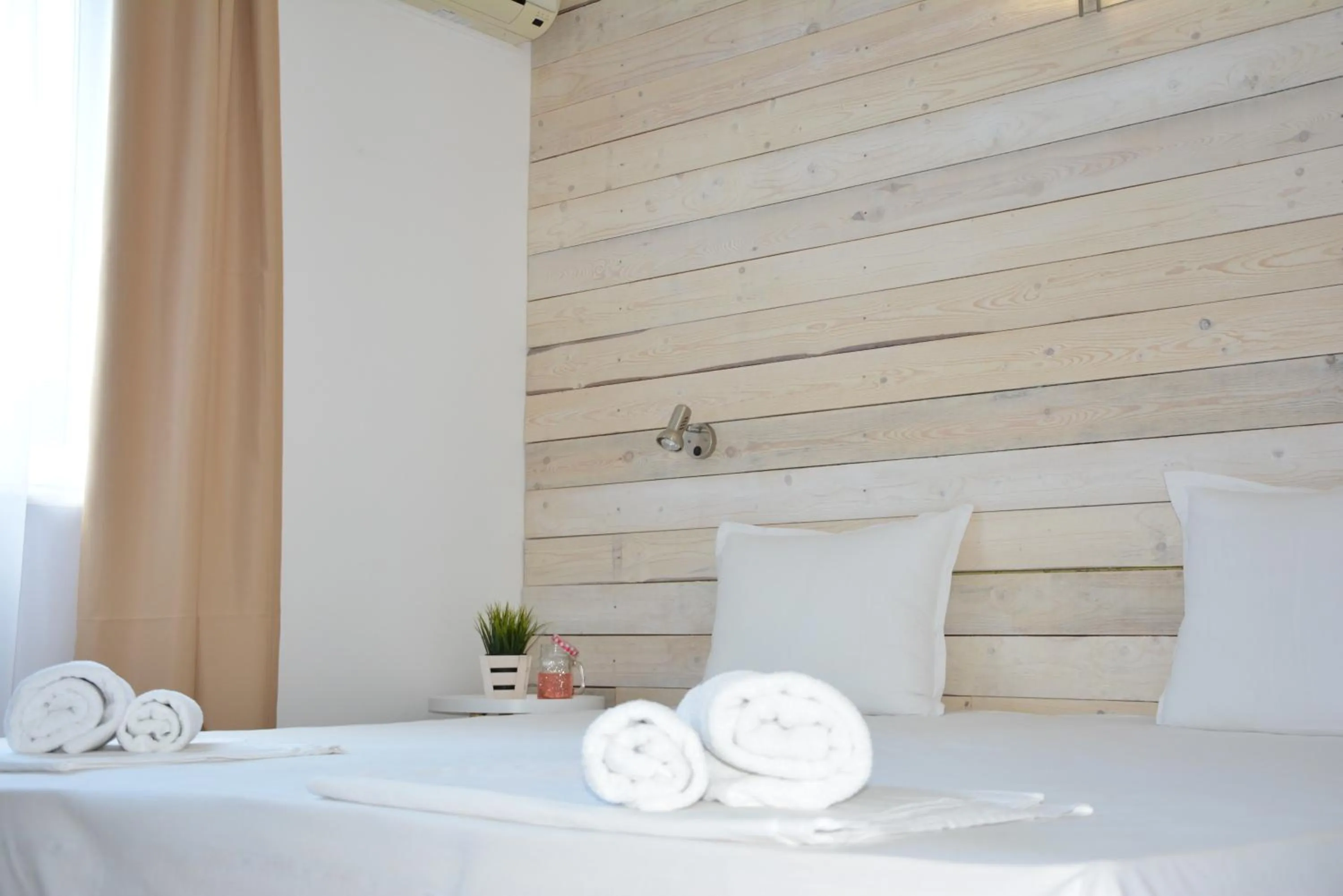 Bed in Milennia Family Hotel