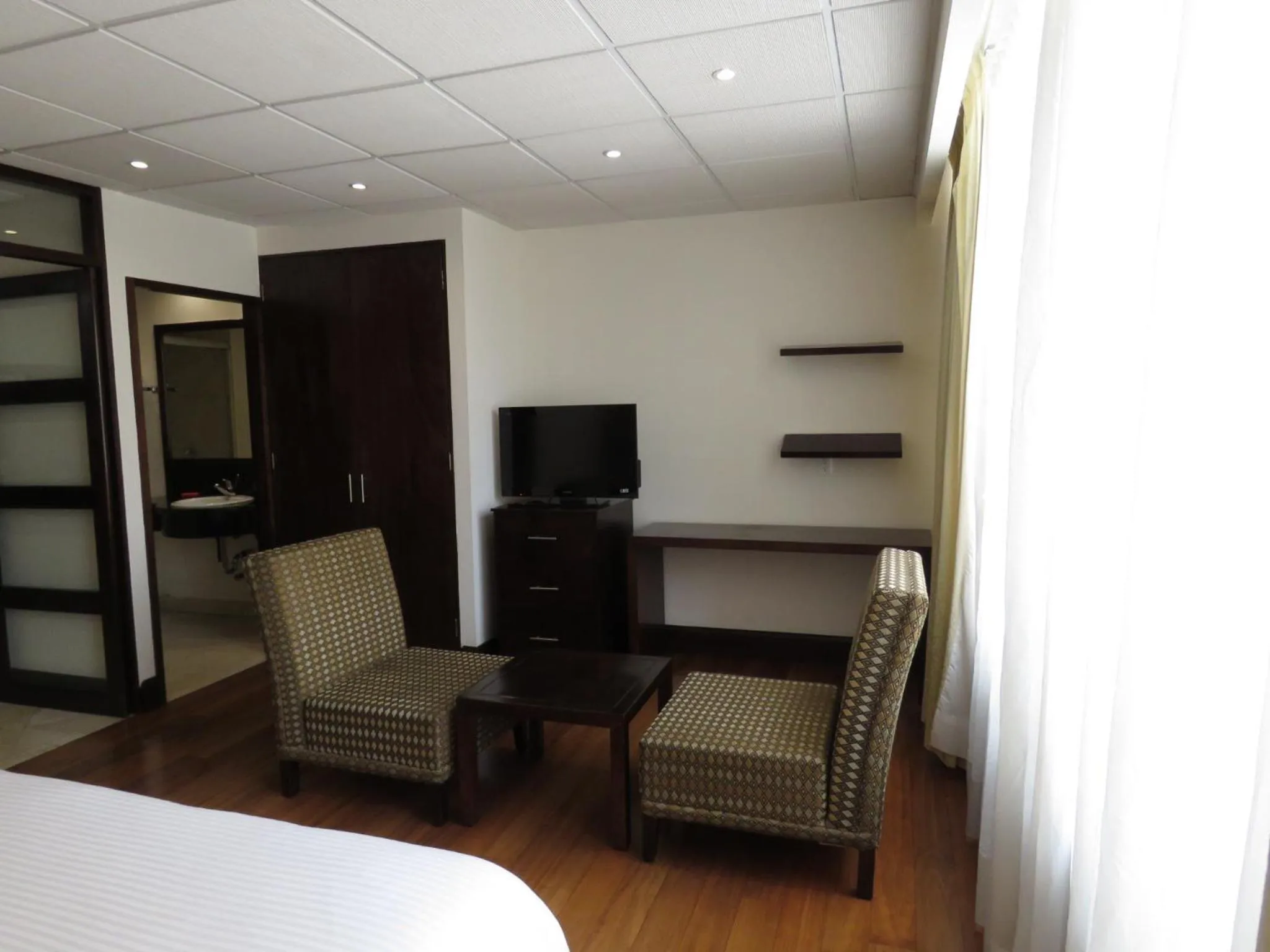 Seating area, Bed in Suites Melchor Ocampo 445