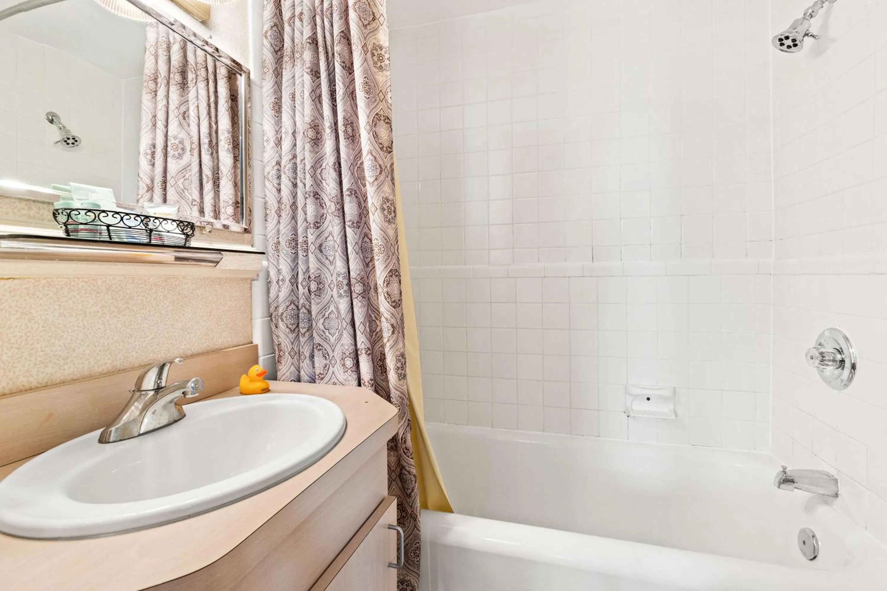 Bathroom in Genetti Hotel, SureStay Collection by Best Western
