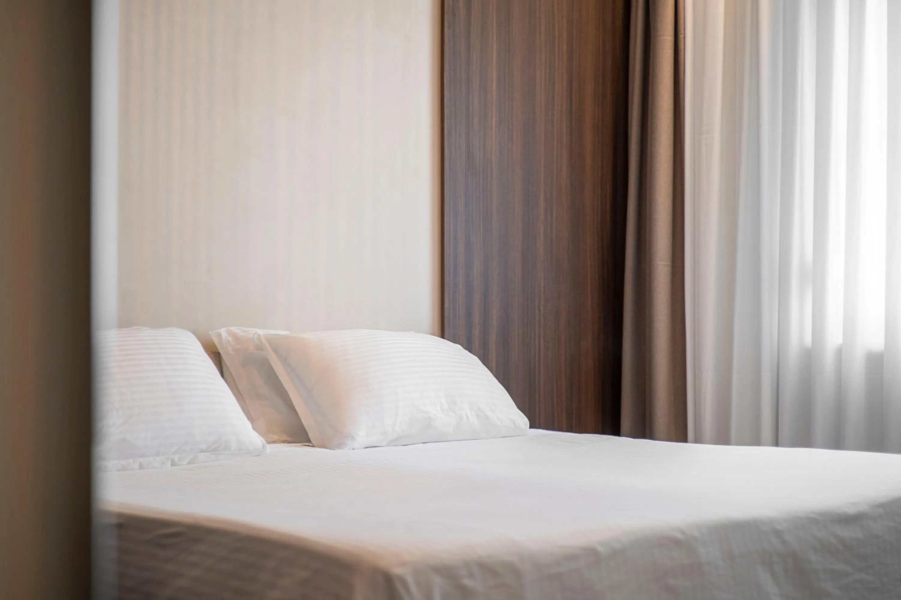 Bed in Lux Apartments