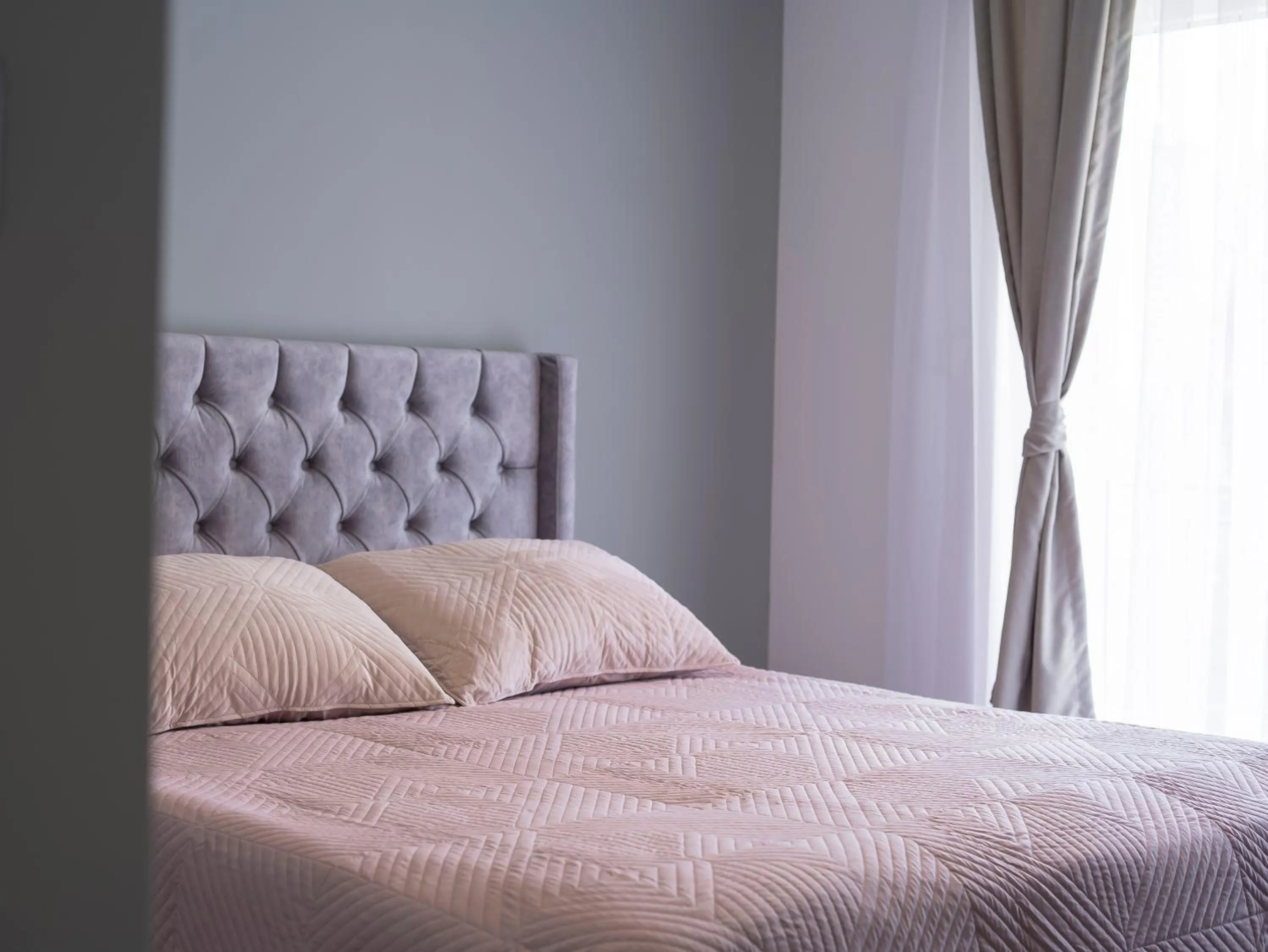 Bed in Lux Apartments