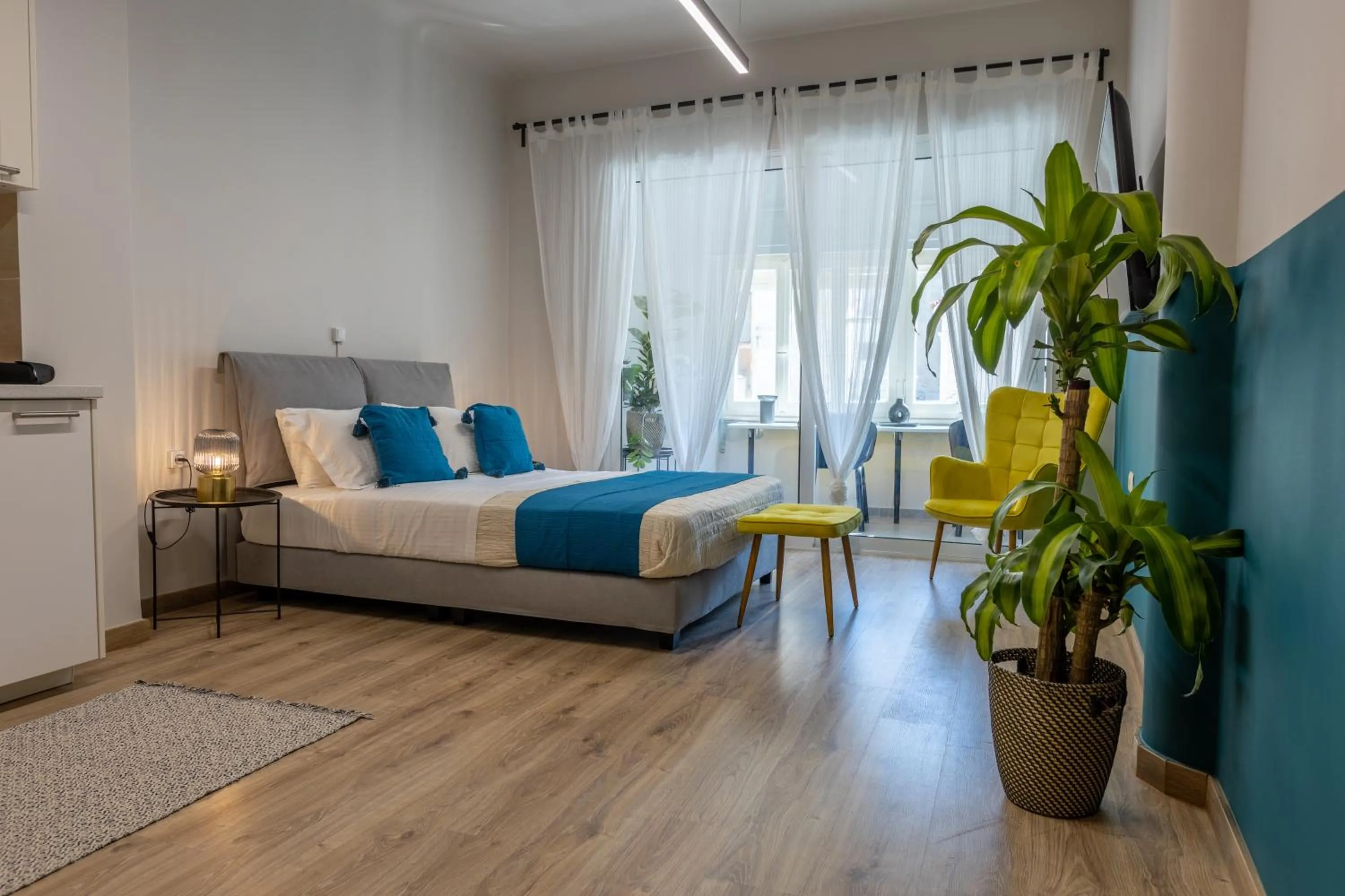 Bed in Athenian Sensations Apartments and Suites in the Heart of Athens