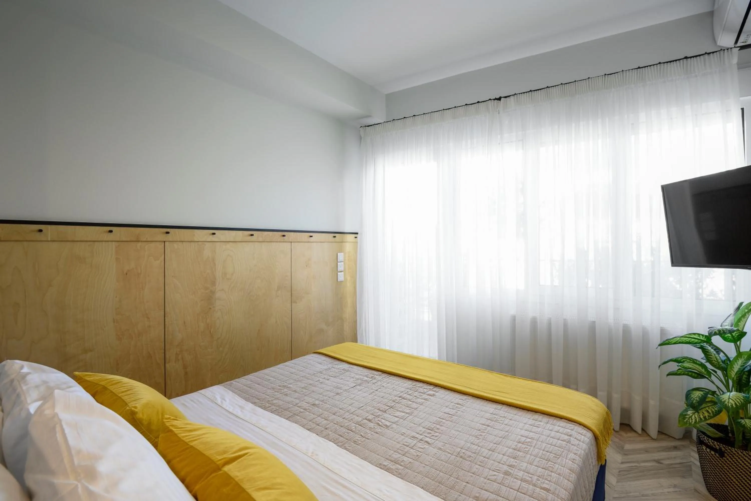 Bed in Athenian Sensations Apartments and Suites in the Heart of Athens