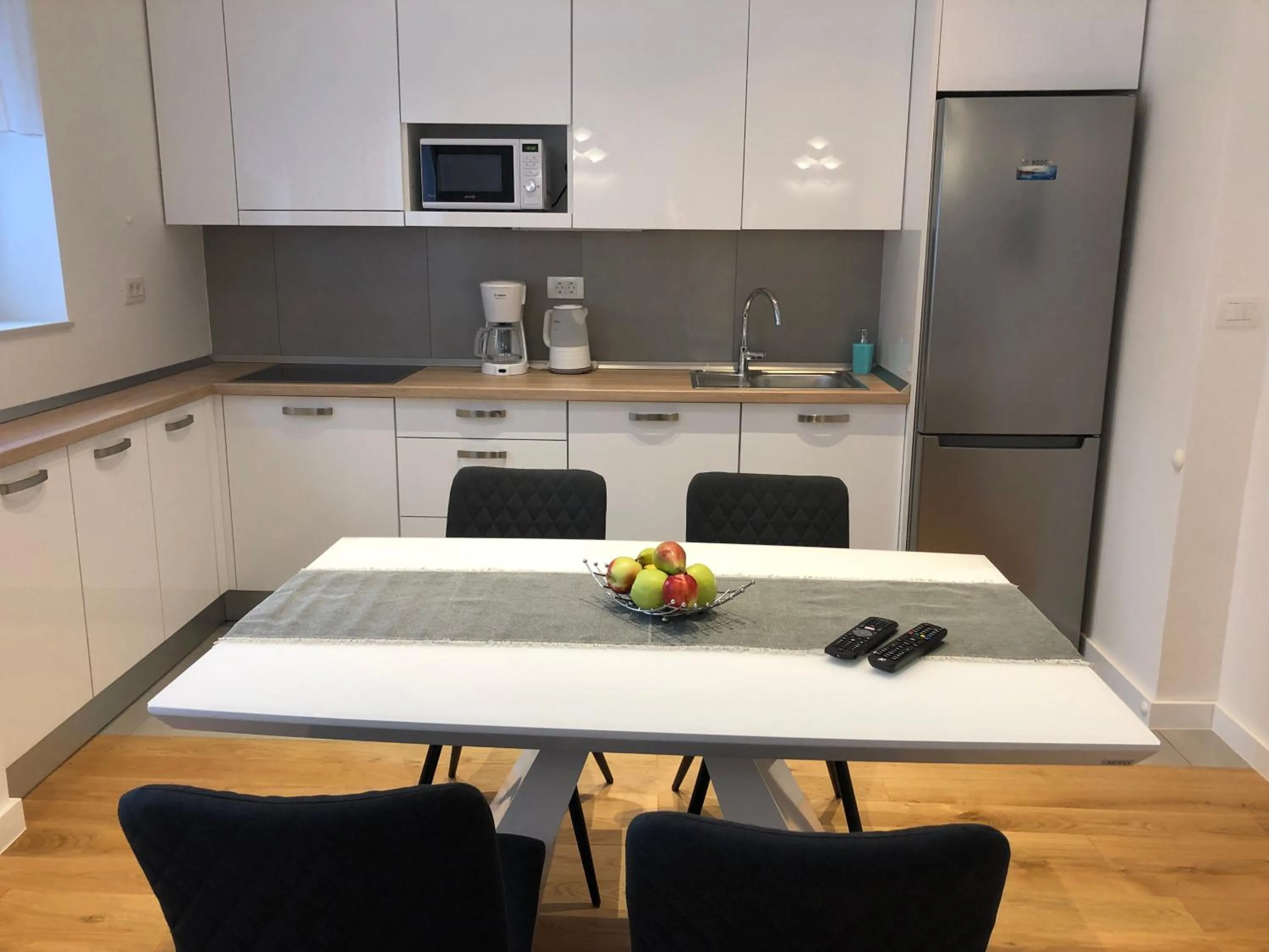 Kitchen or kitchenette in Tempus Apartment