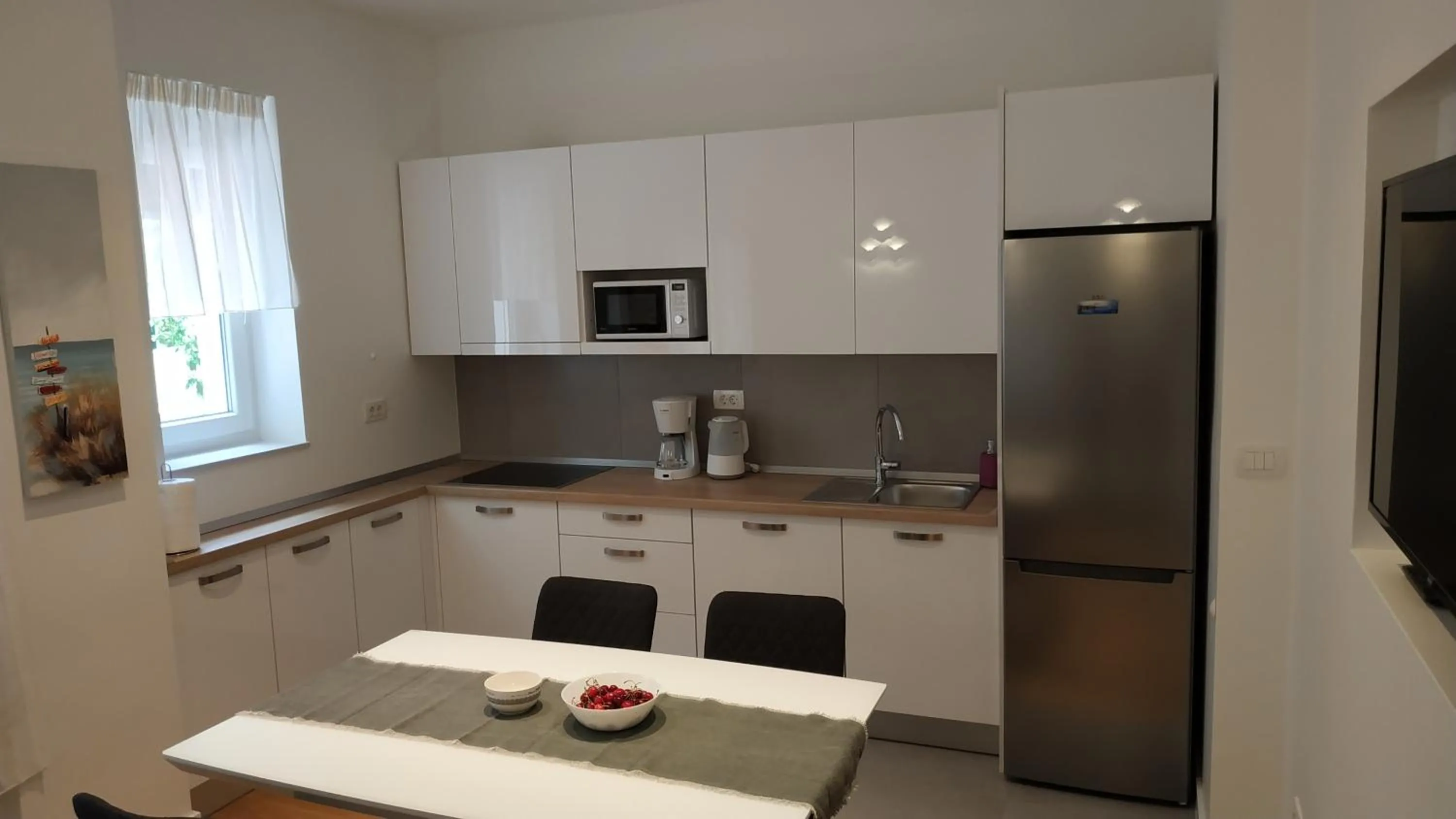 Kitchen or kitchenette in Tempus Apartment