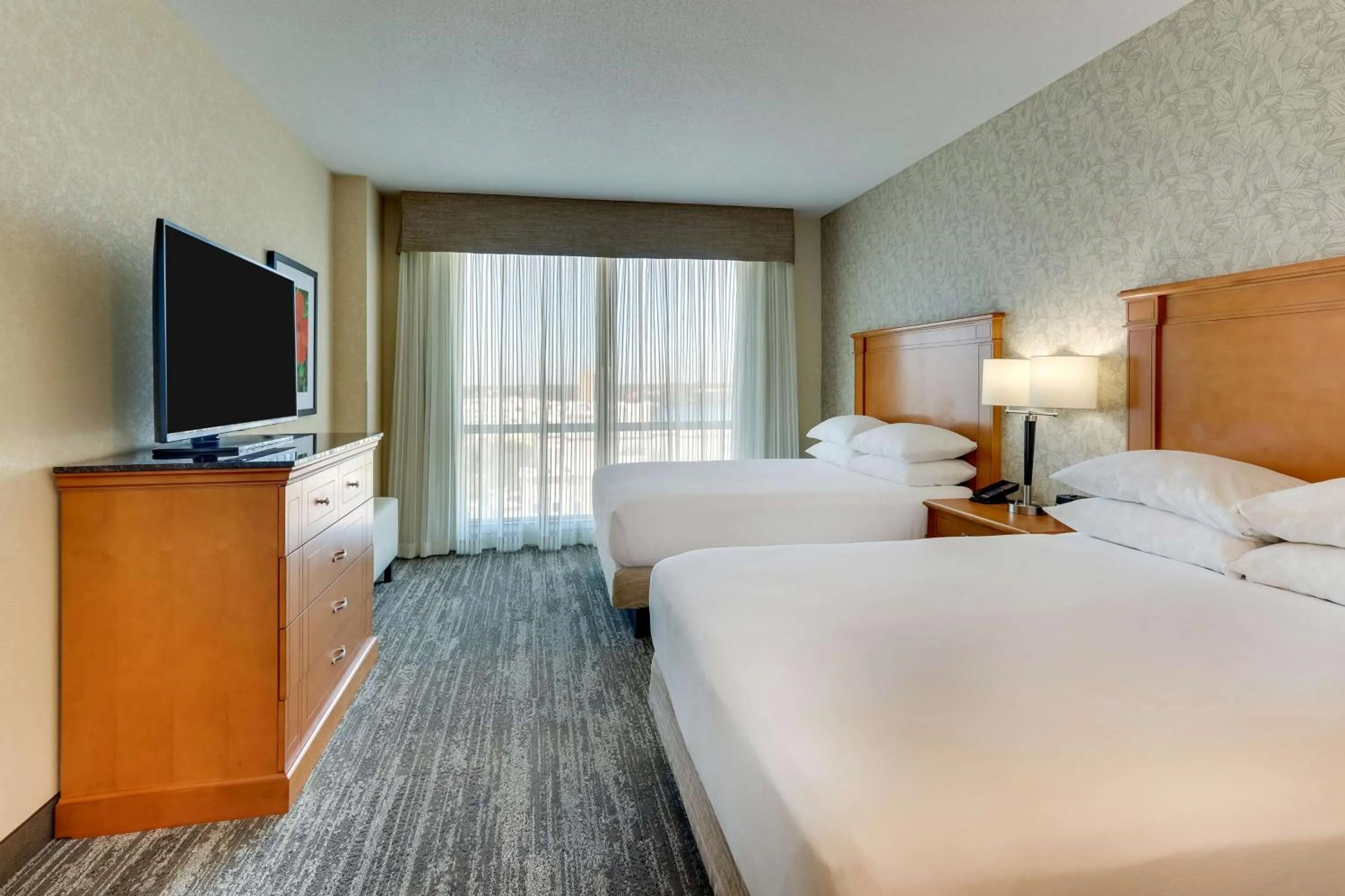 Photo of the whole room, Bed in Drury Inn & Suites Orlando near Universal Orlando Resort