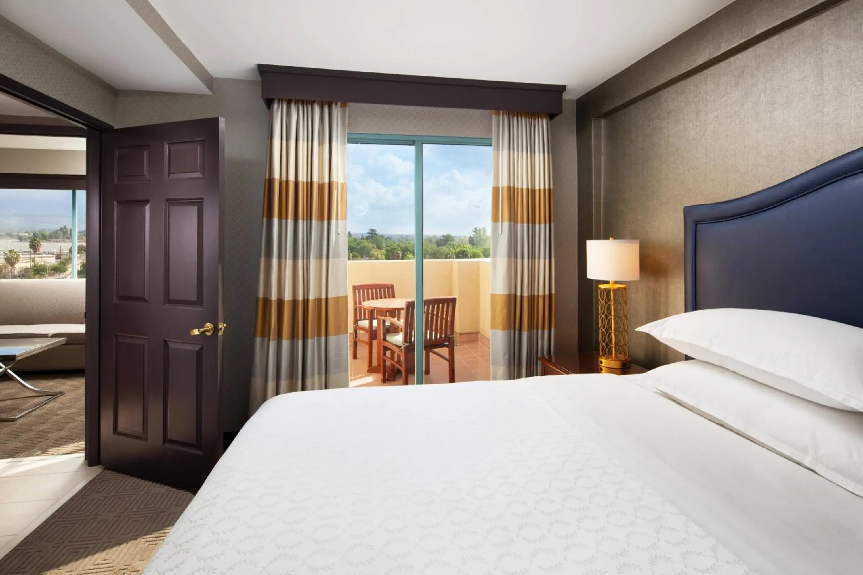 Guest room, 1 King, Sofa bed, Corner room, Top floor in Sheraton Fairplex Suites & Conference Center Guest room, 1 King, Sofa bed, Corner room, Top floor in Sheraton Fairplex Suites & Conference Center