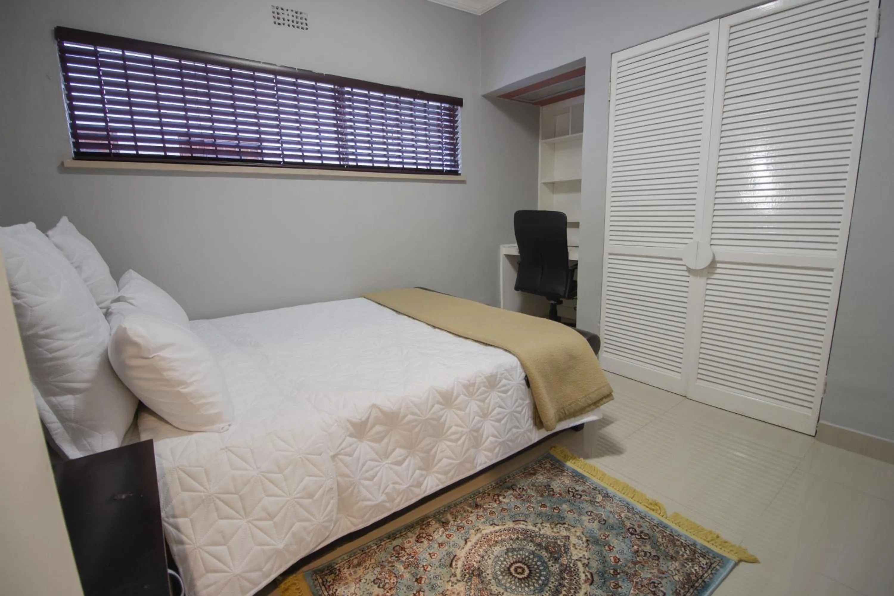 Photo of the whole room, Bed in The Afropolitan