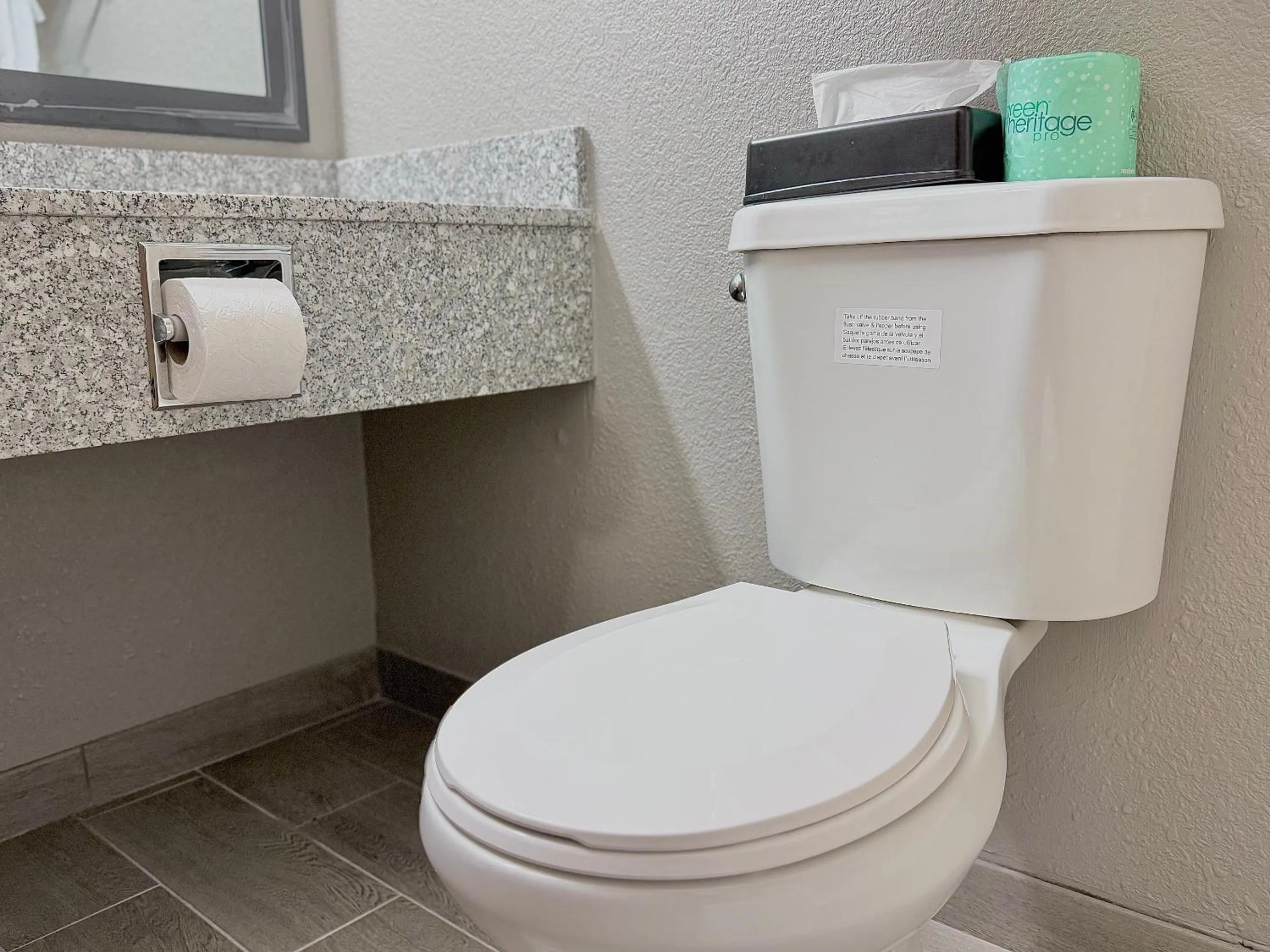 Toilet in American Inn Cedar Rapids South