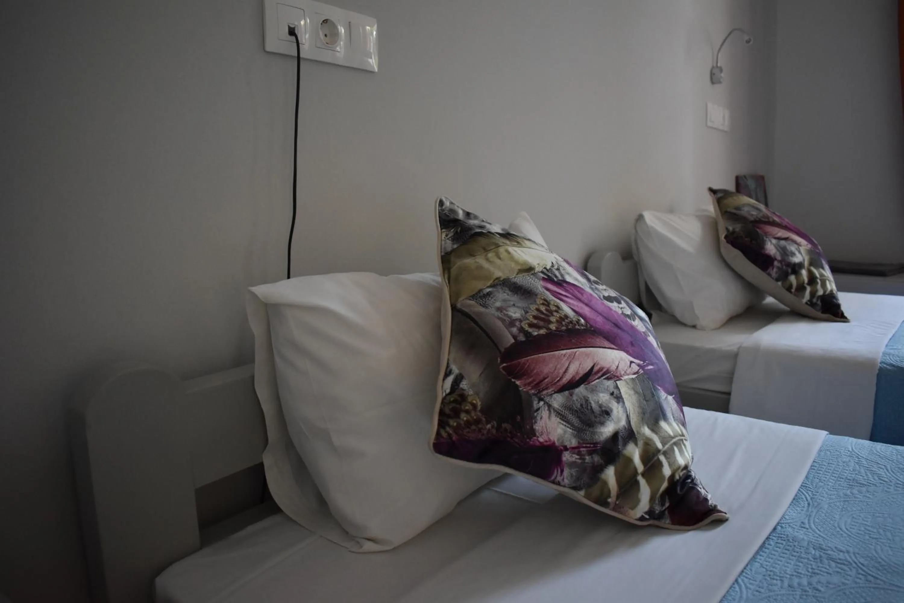 Bed in Aphrodite Art Hotel Aegina