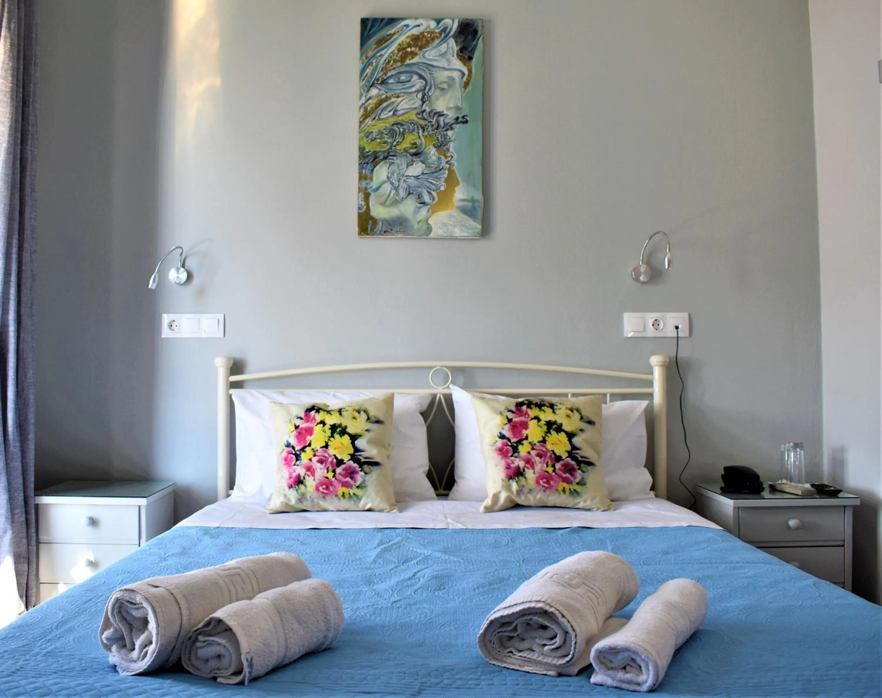 Bed in Aphrodite Art Hotel Aegina