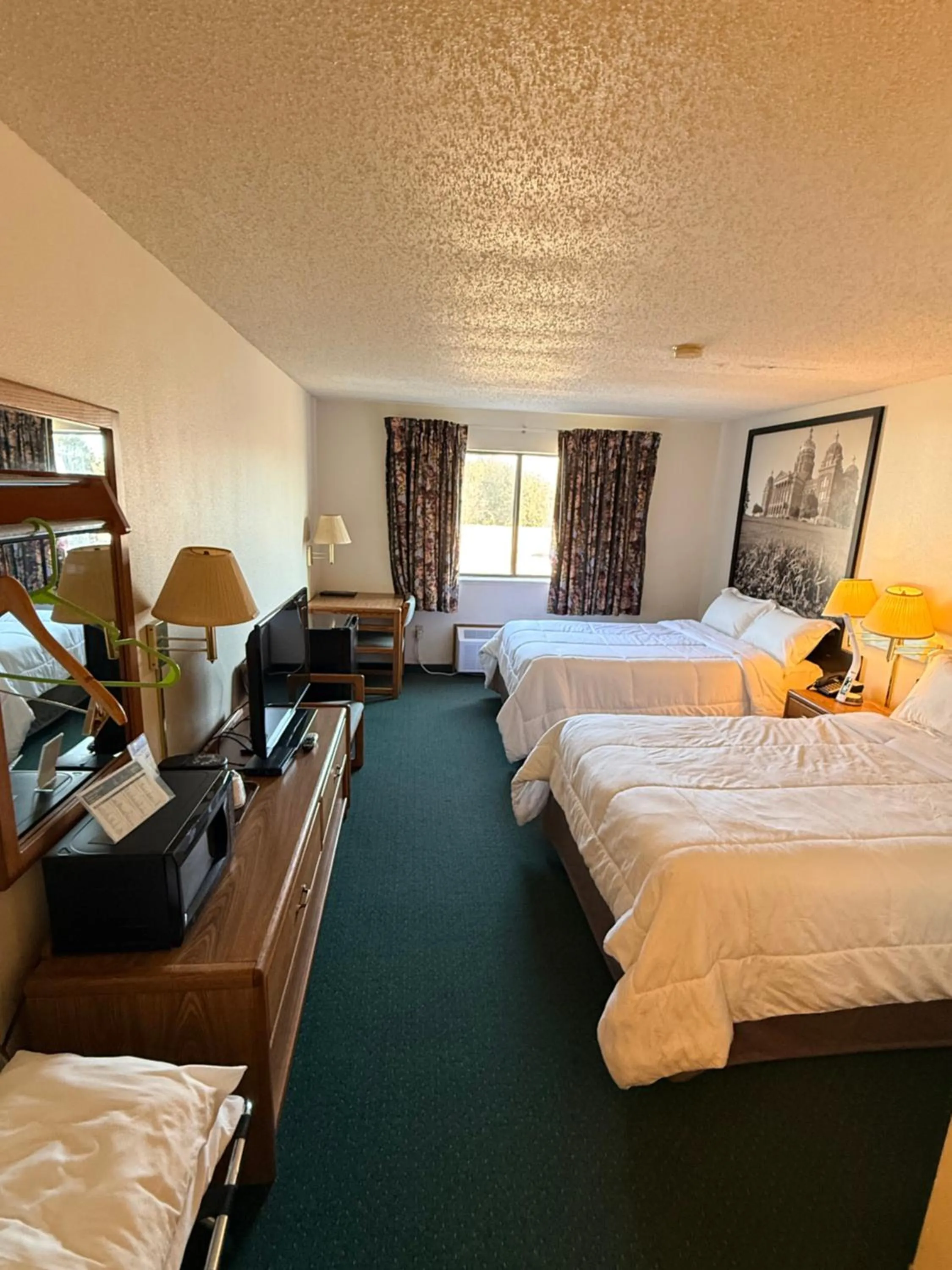 Bed in Budget inn & Suites