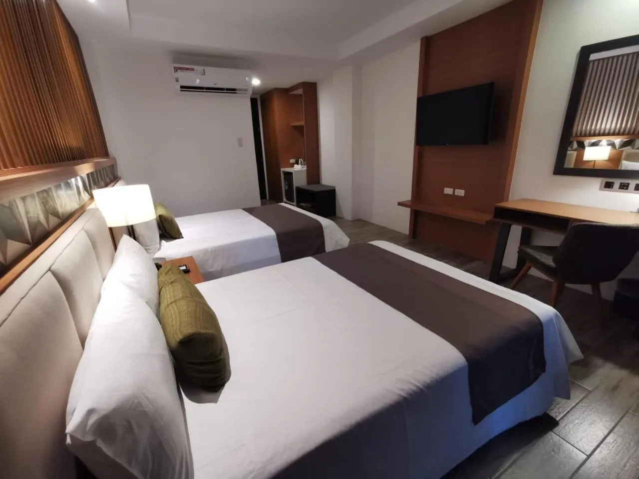 Bed in Crown Hotel at Harbour Springs Palawan Managed by Enderun Hotels