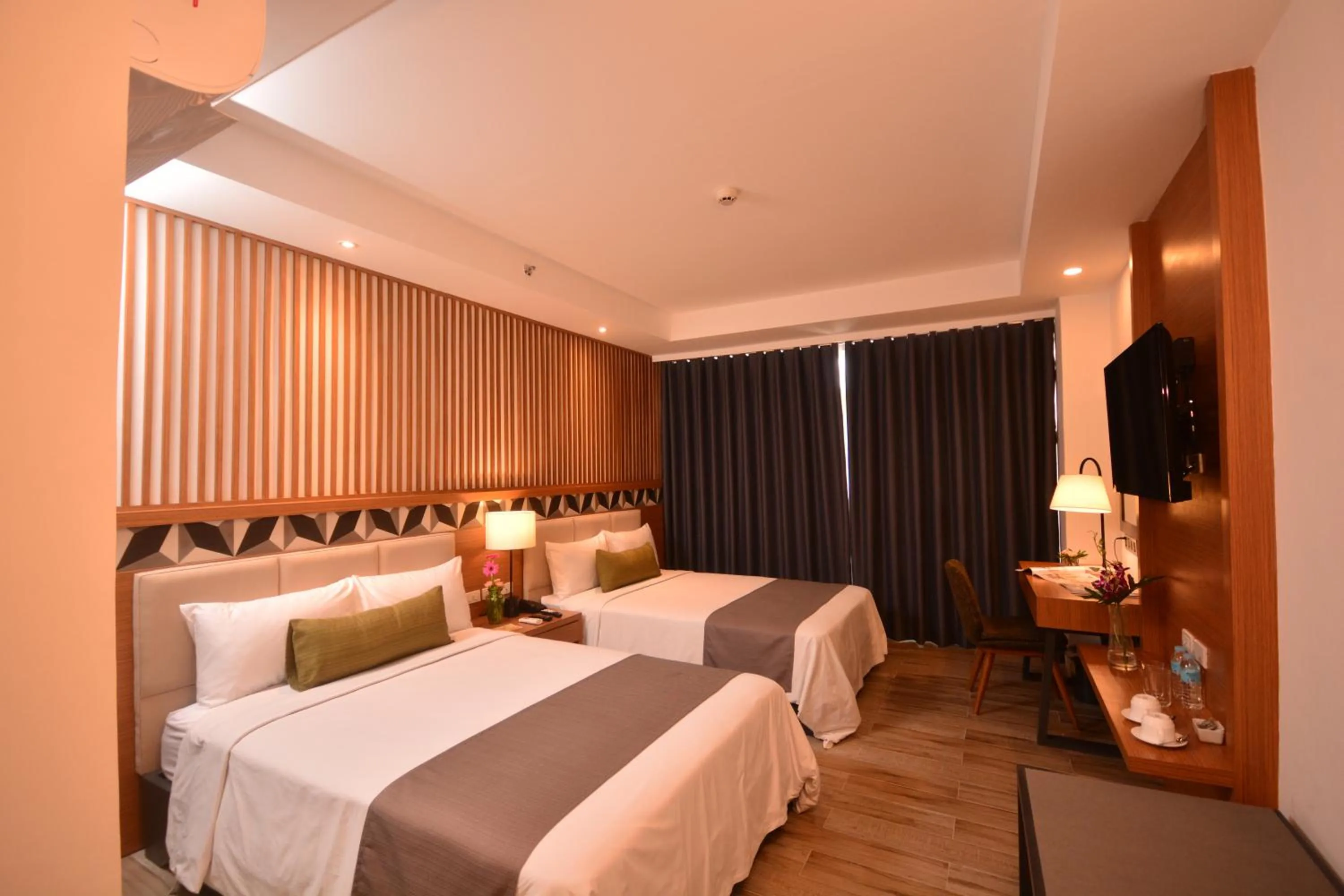 Photo of the whole room, Bed in Crown Hotel at Harbour Springs Palawan Managed by Enderun Hotels