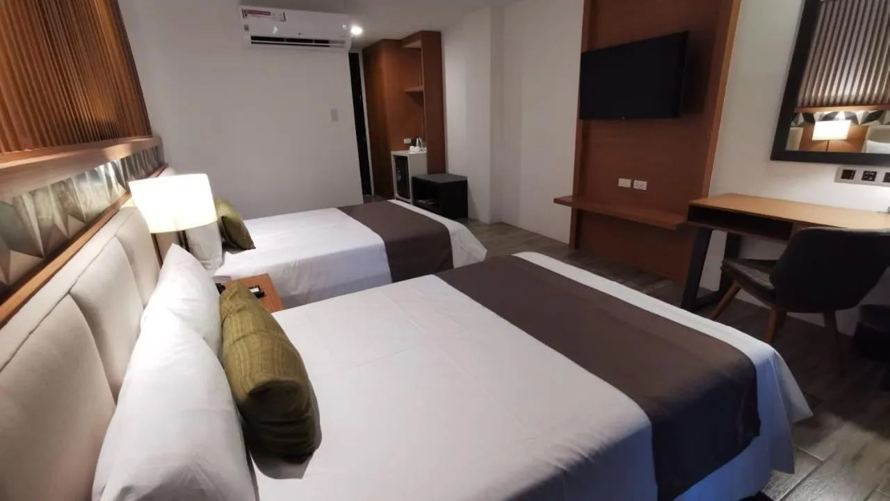 Photo of the whole room, Bed in Crown Hotel at Harbour Springs Palawan Managed by Enderun Hotels