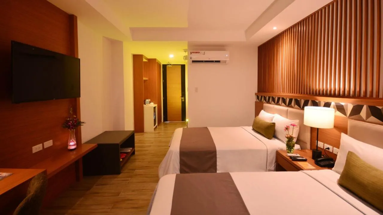 Photo of the whole room, Bed in Crown Hotel at Harbour Springs Palawan Managed by Enderun Hotels