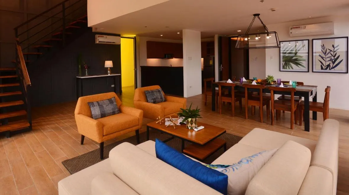 Living room in Crown Hotel at Harbour Springs Palawan Managed by Enderun Hotels