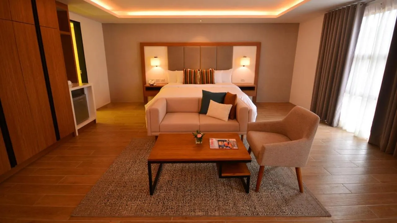 Seating area, Bed in Crown Hotel at Harbour Springs Palawan Managed by Enderun Hotels