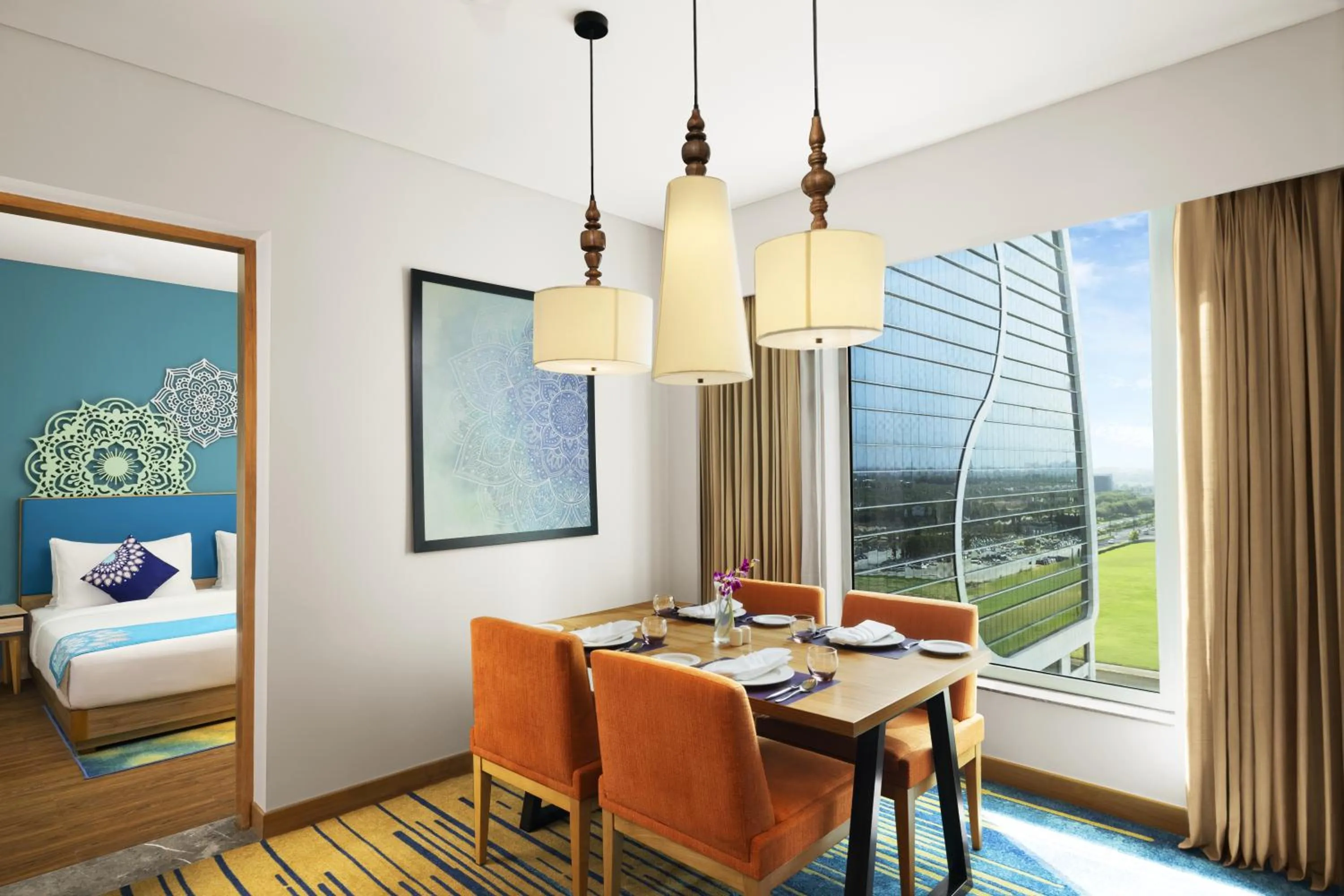 Dining area, Bed in Grand Mercure Ahmedabad GIFT City - An Accor Hotels Brand