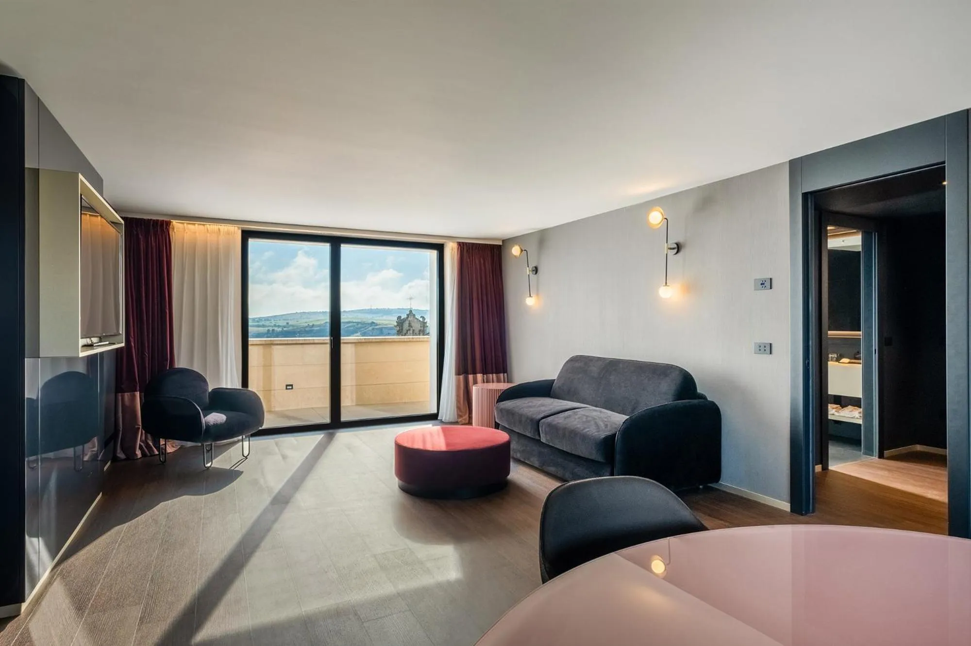 Living room, Bed in Eurostars Matera La Suite