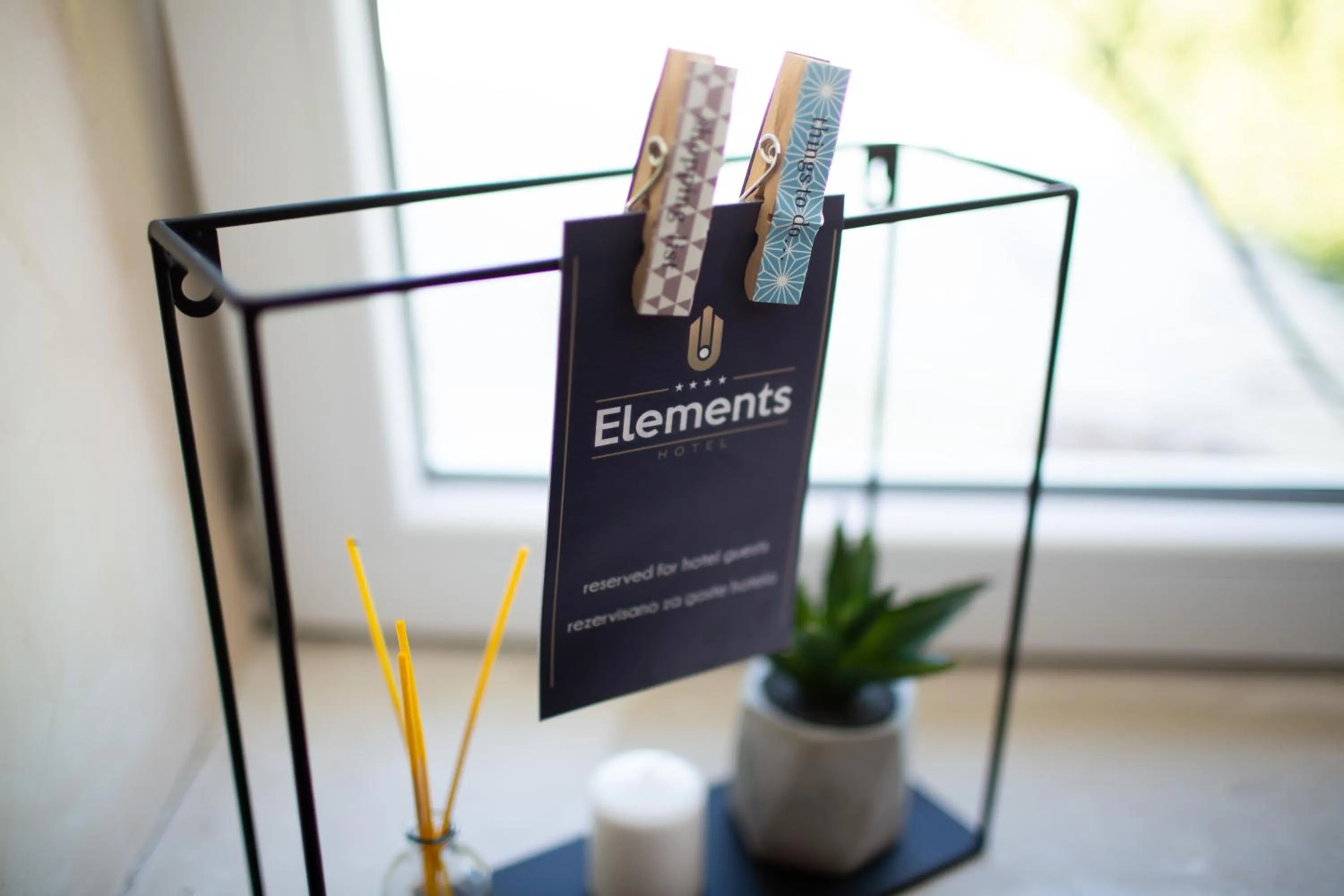 Property logo or sign in Hotel Elements