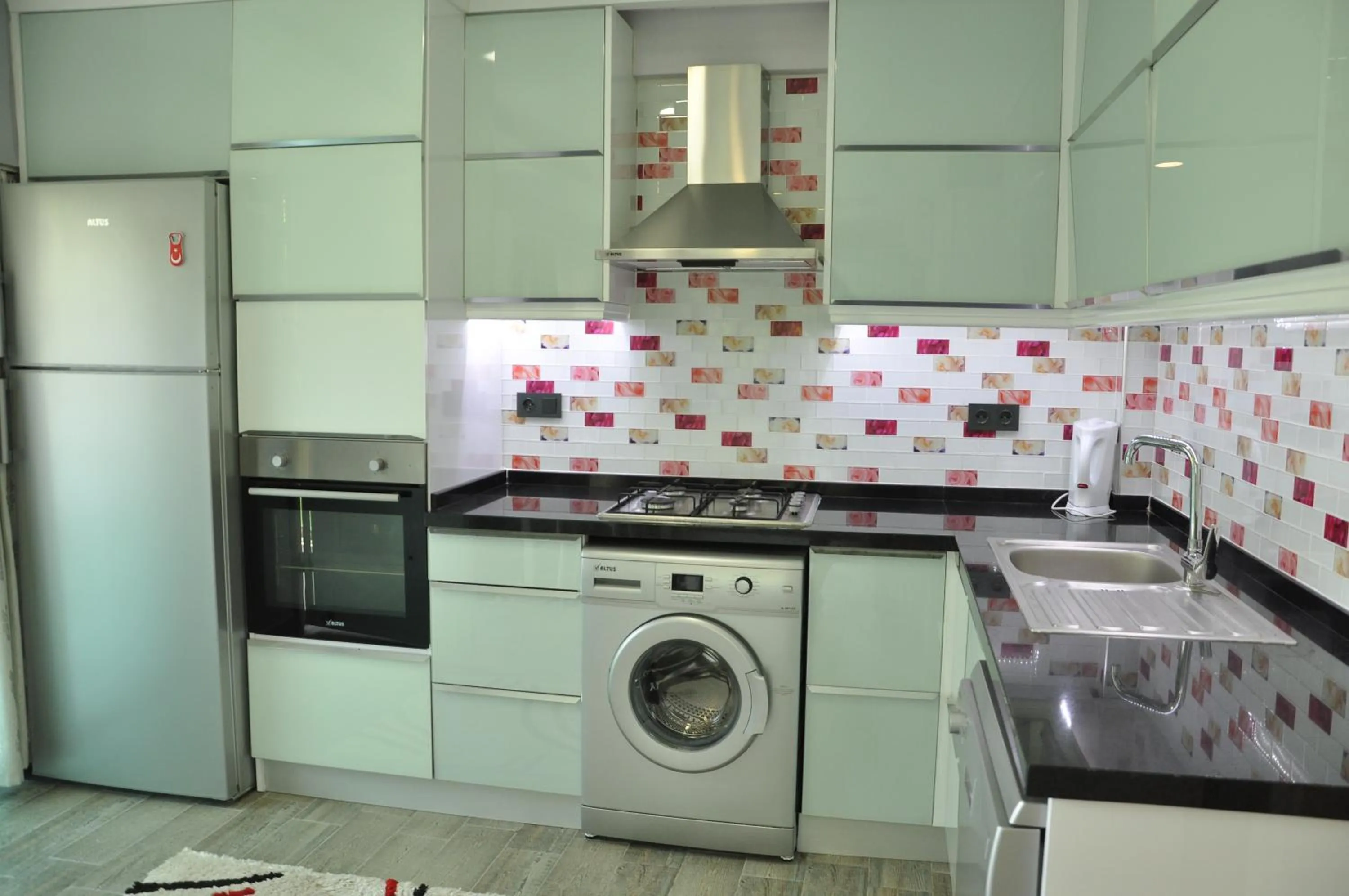 Kitchen or kitchenette in X SUITE APART