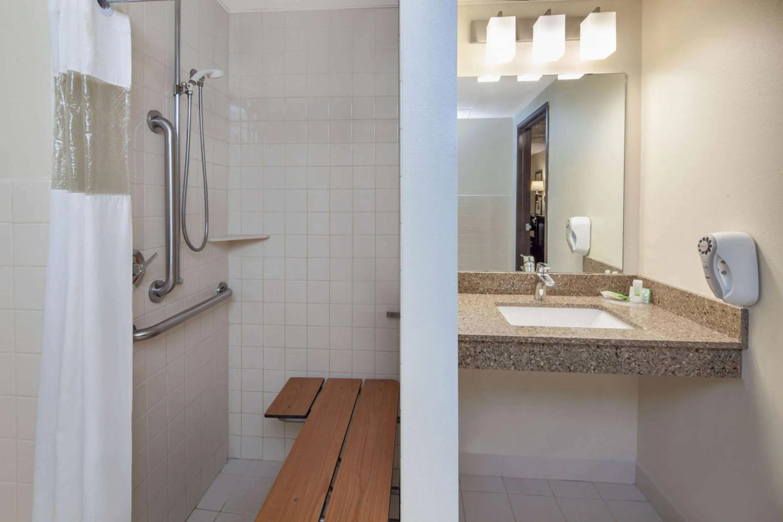 Shower in AmericInn by Wyndham Northfield