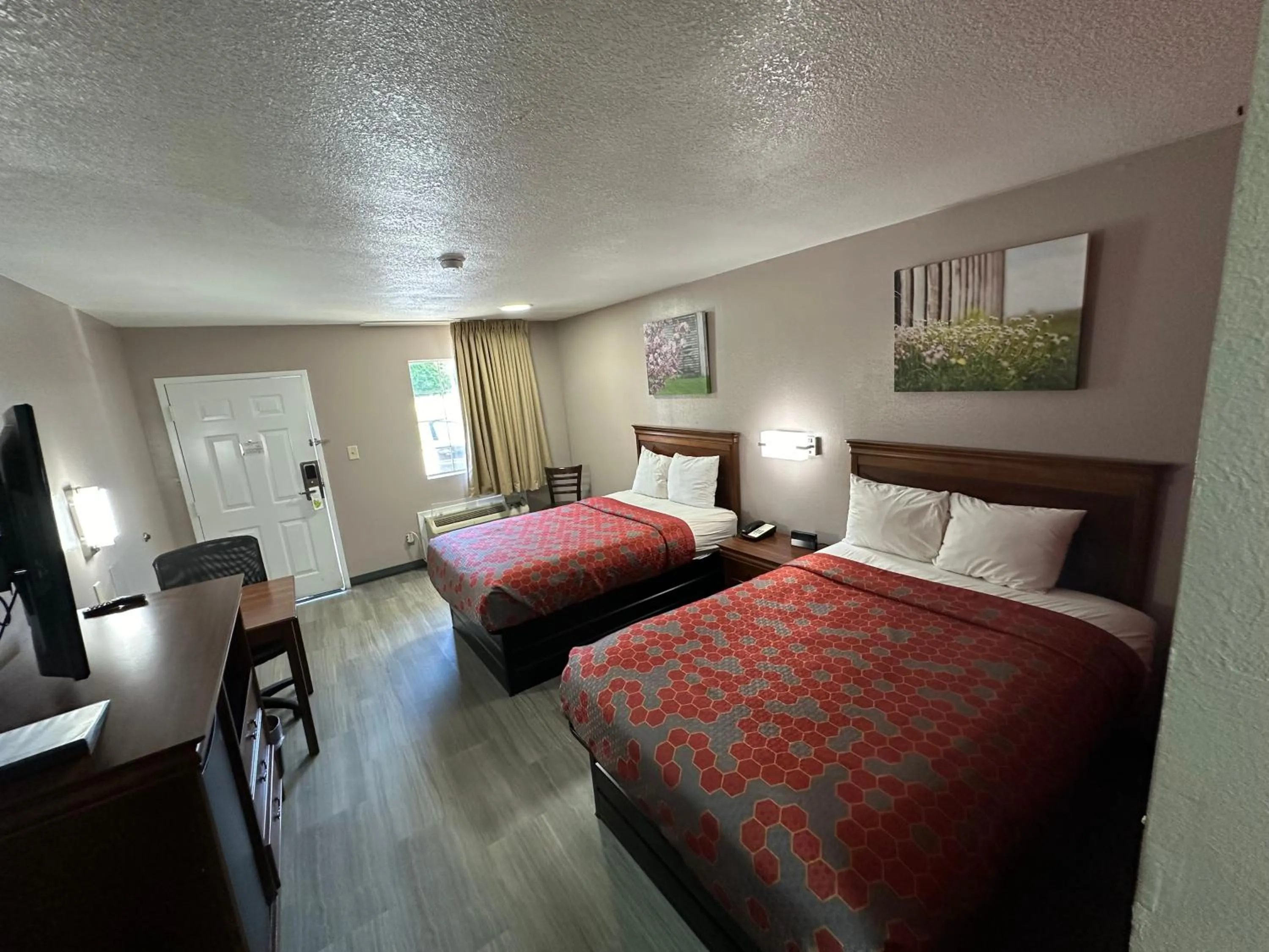 Bed in The Heritage Inn, Inc