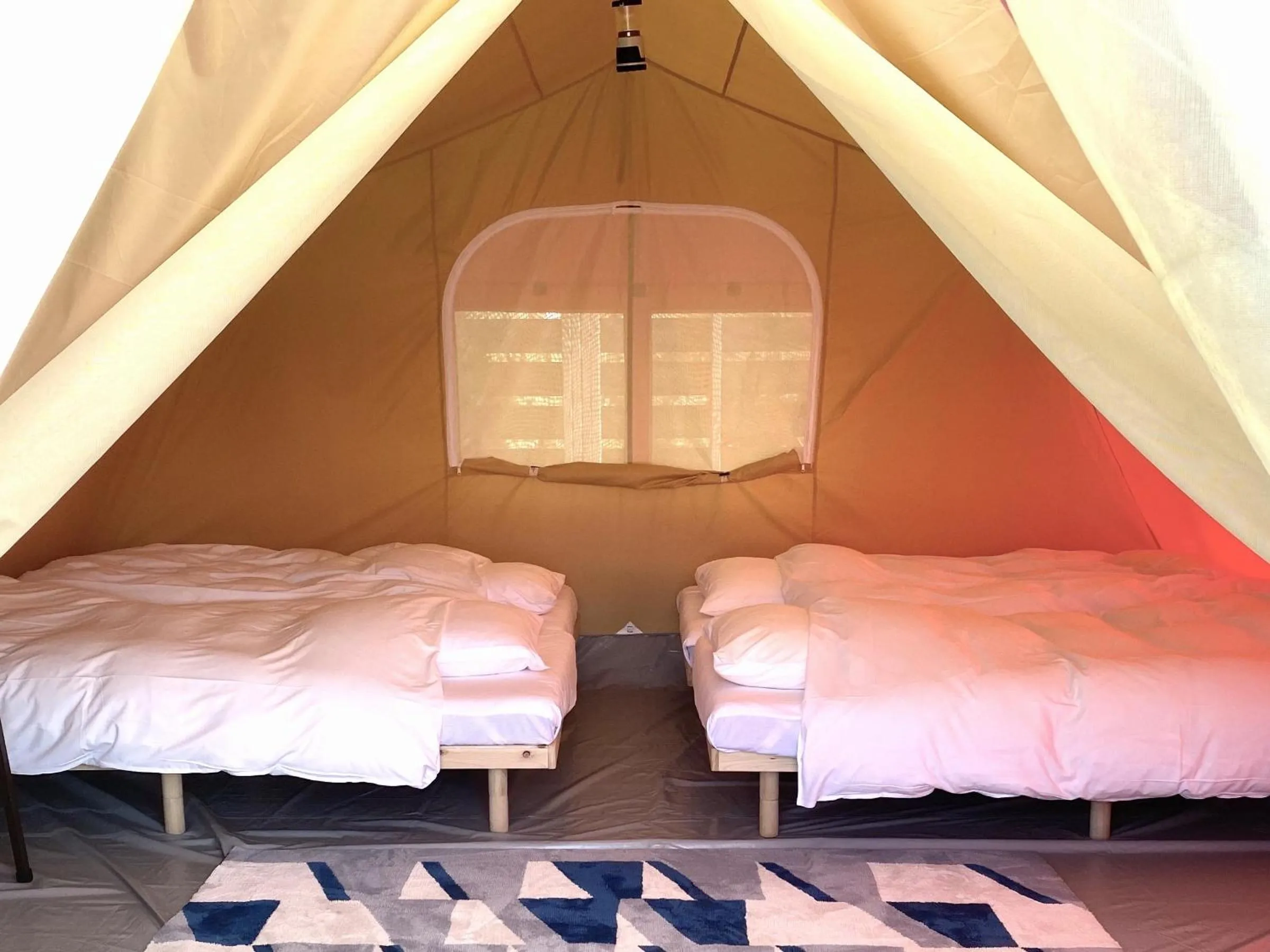 Bed in Chikura Tsunagu Hotel