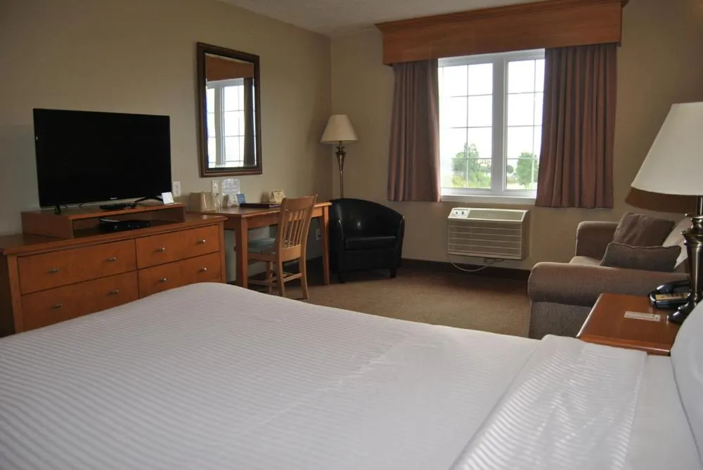 Bed in Auberge Bouctouche Inn & Suites