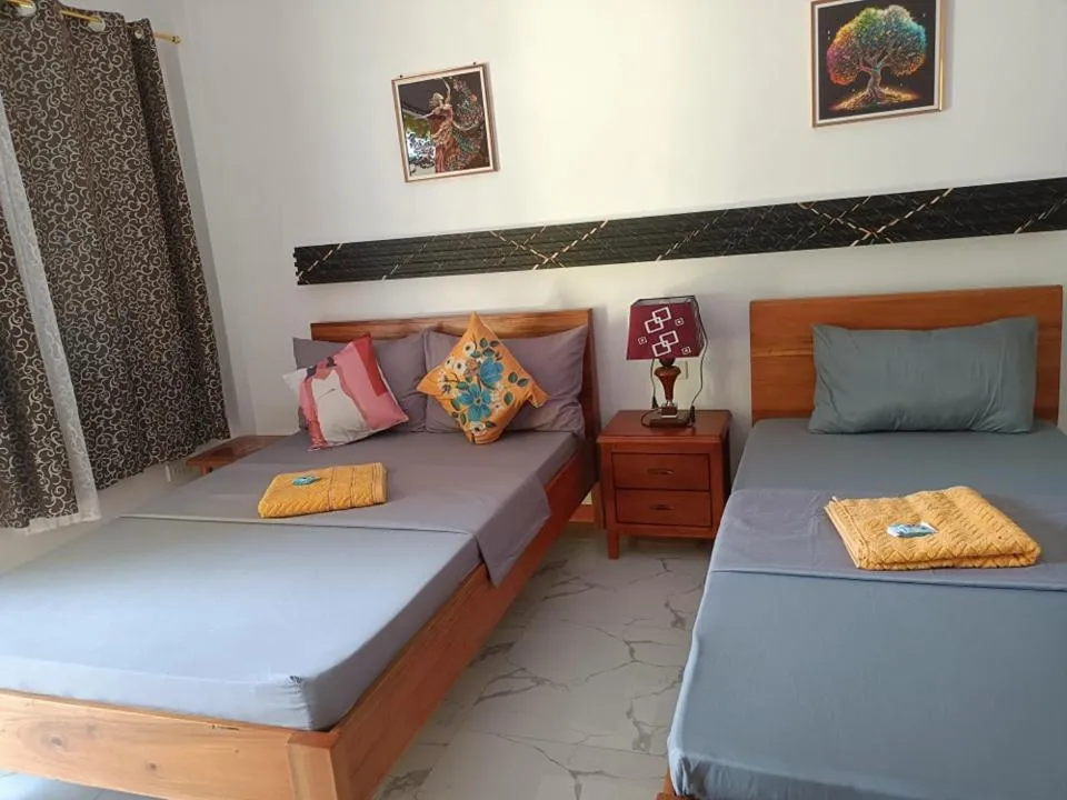 Photo of the whole room, Bed in Alona J&J Tourist Inn