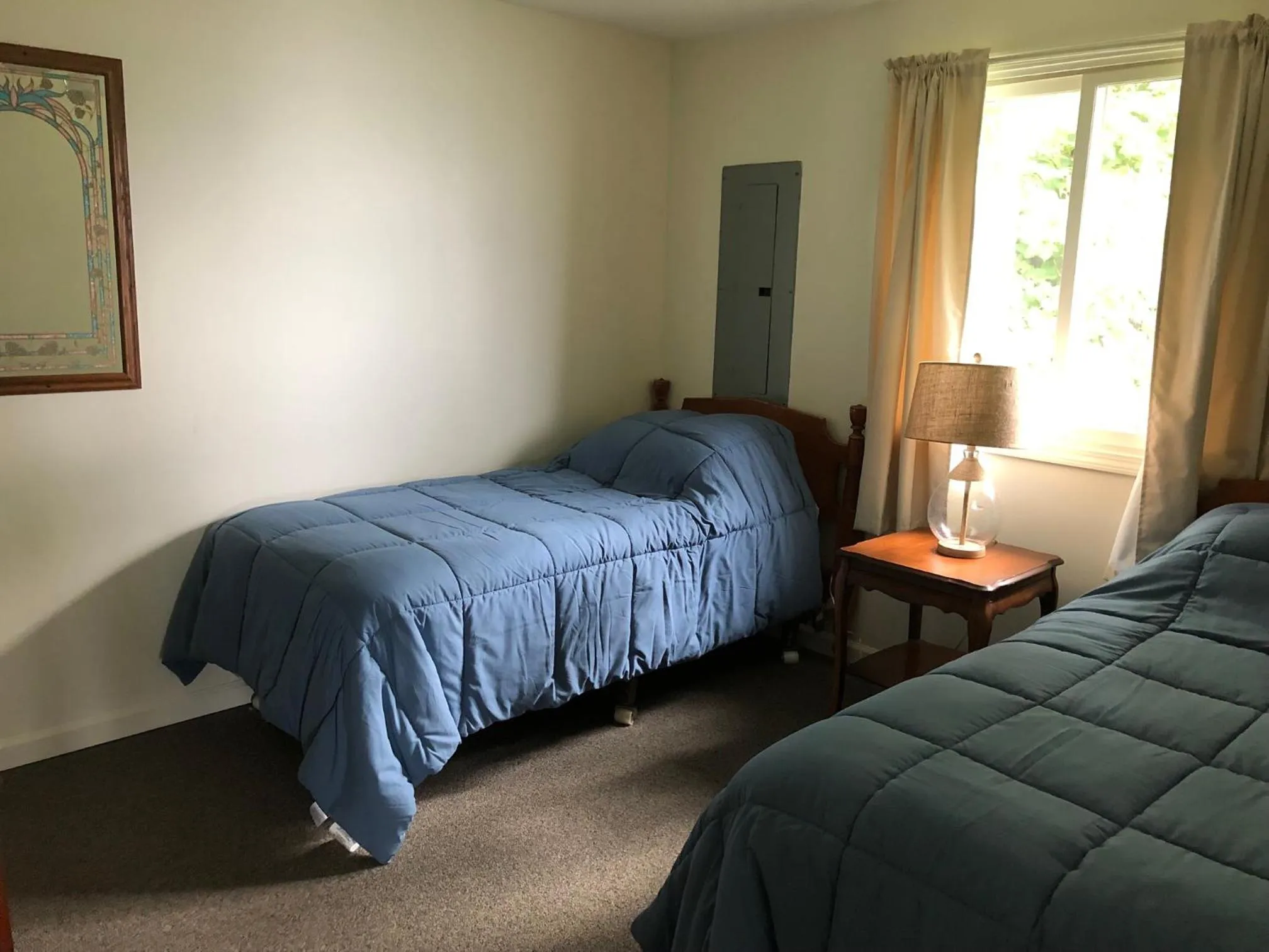 Bed in West Winds Motel & Cottages