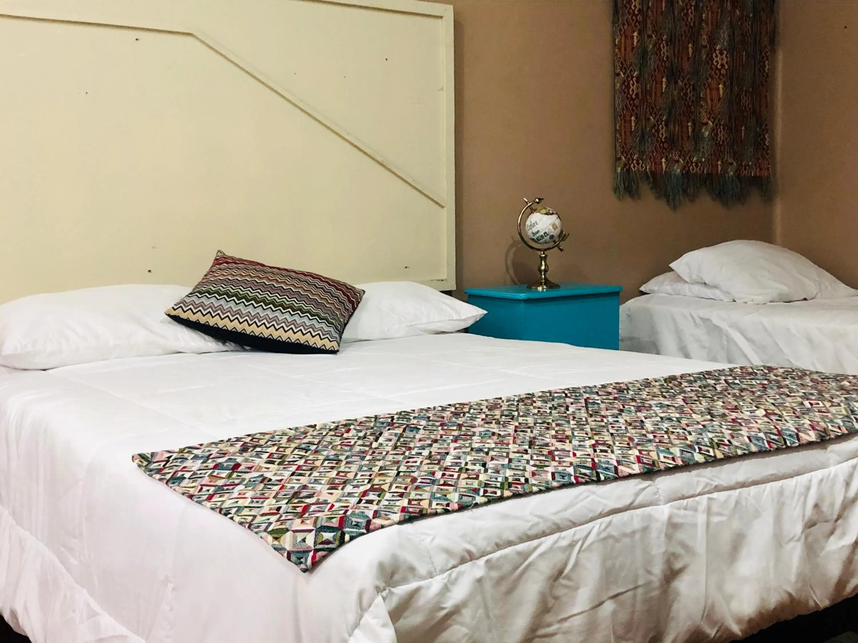 Bed in Hostal Kuira Bá by Rotamundos