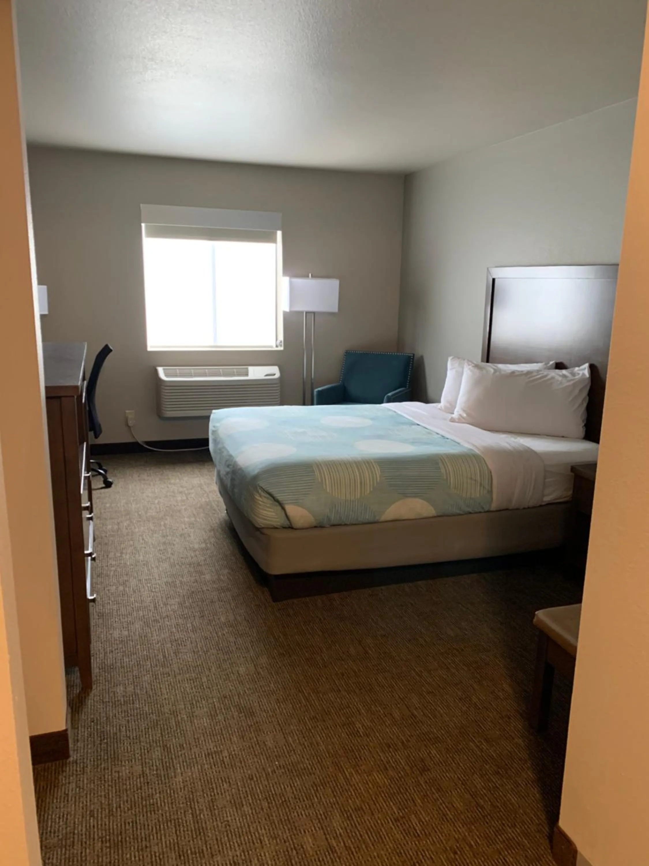 Bed in Sandhill Inn & Suites