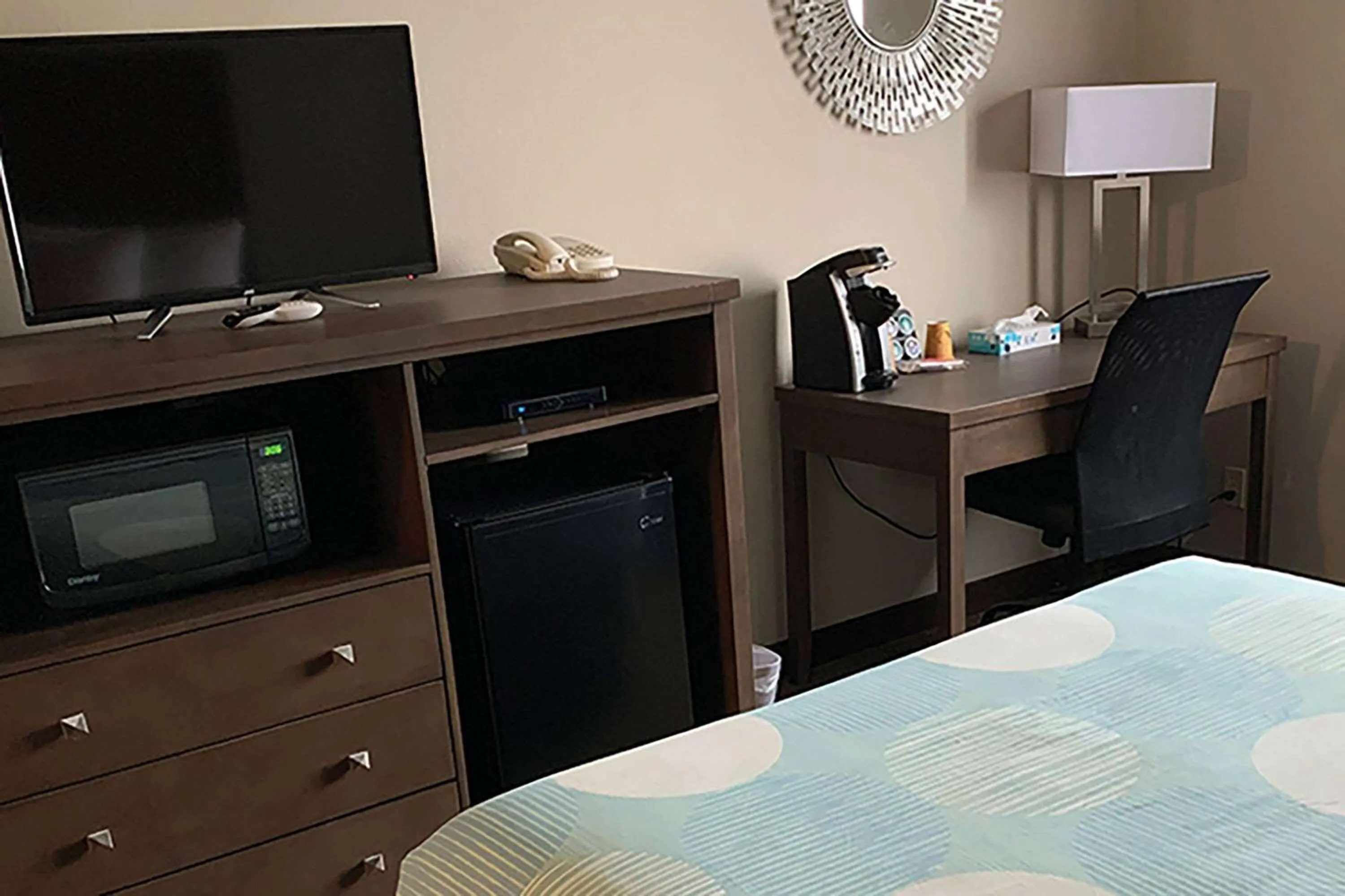 Photo of the whole room, TV/Entertainment Center in Sandhill Inn & Suites