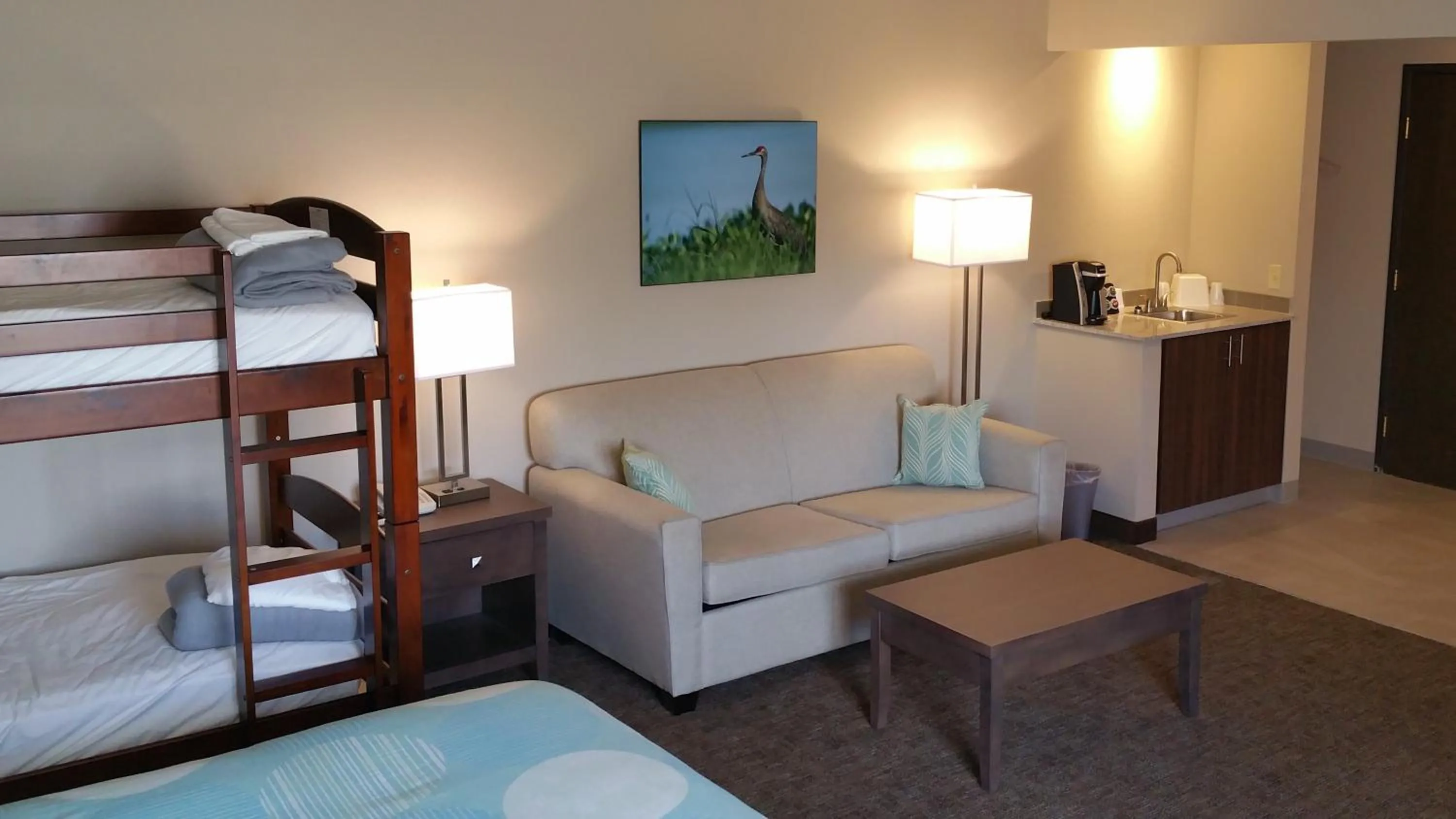 Bed in Sandhill Inn & Suites