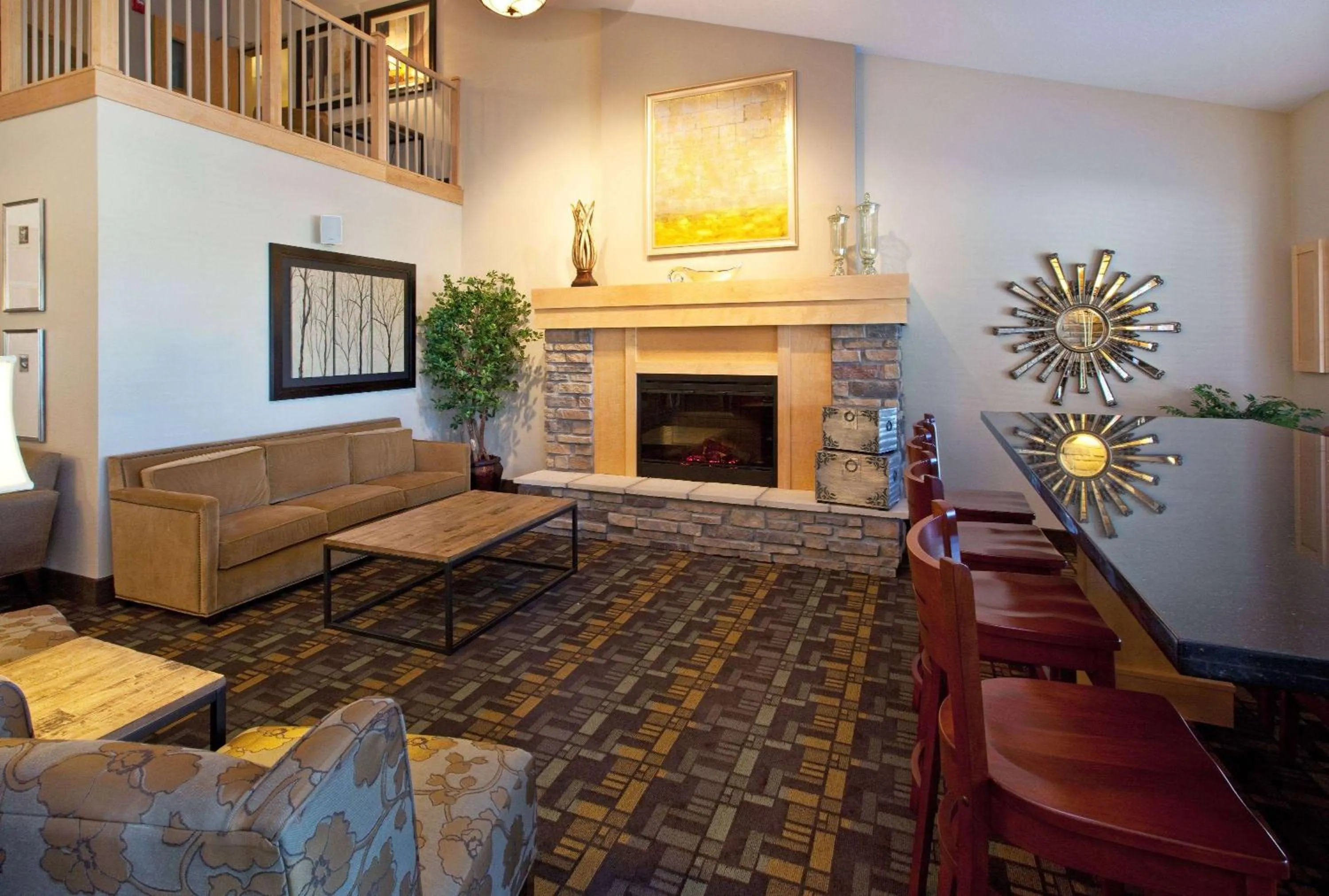 Seating area in AmericInn by Wyndham Osage