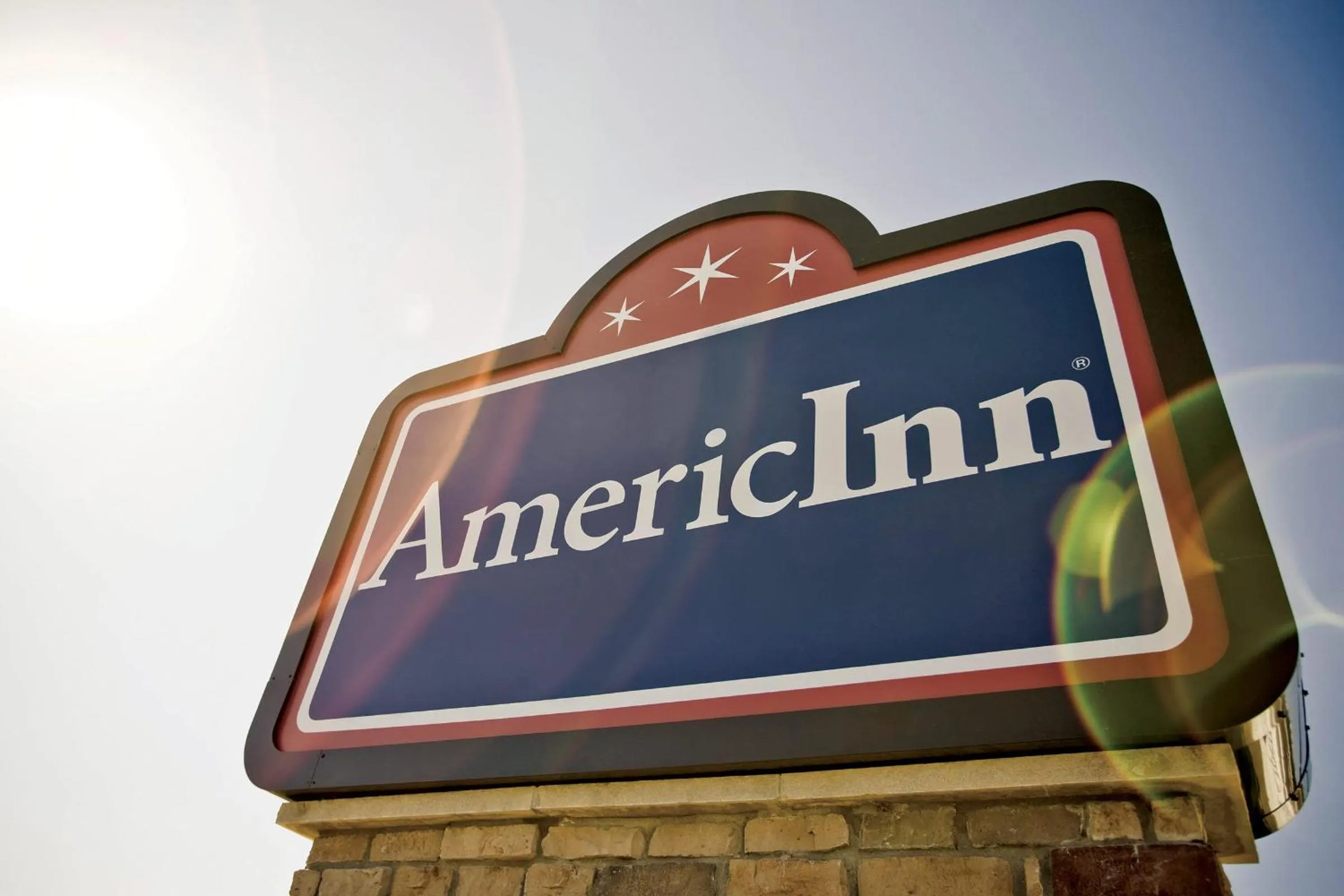 Property logo or sign in AmericInn by Wyndham Osage