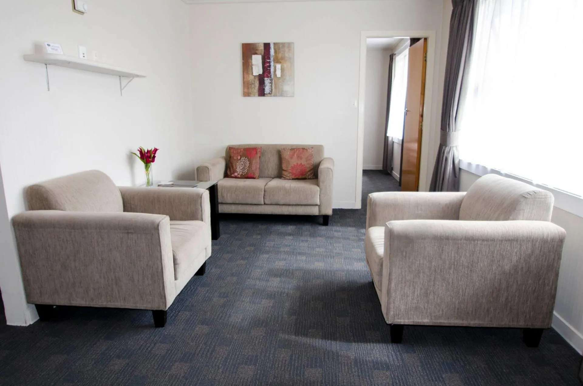 Seating area in ASURE Oakleigh Motel