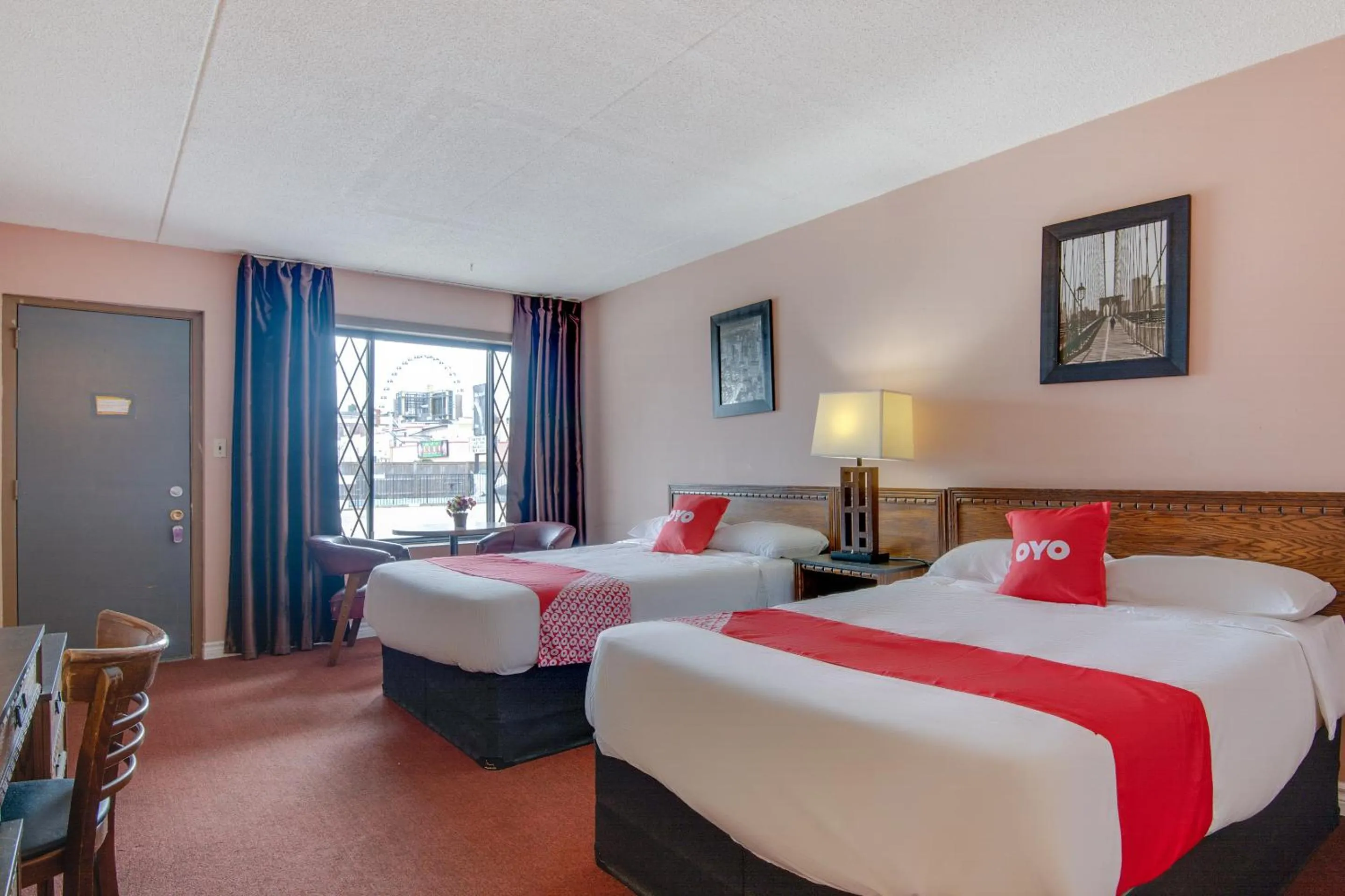 Bedroom in Falls Inn Near Casino Niagara By OYO