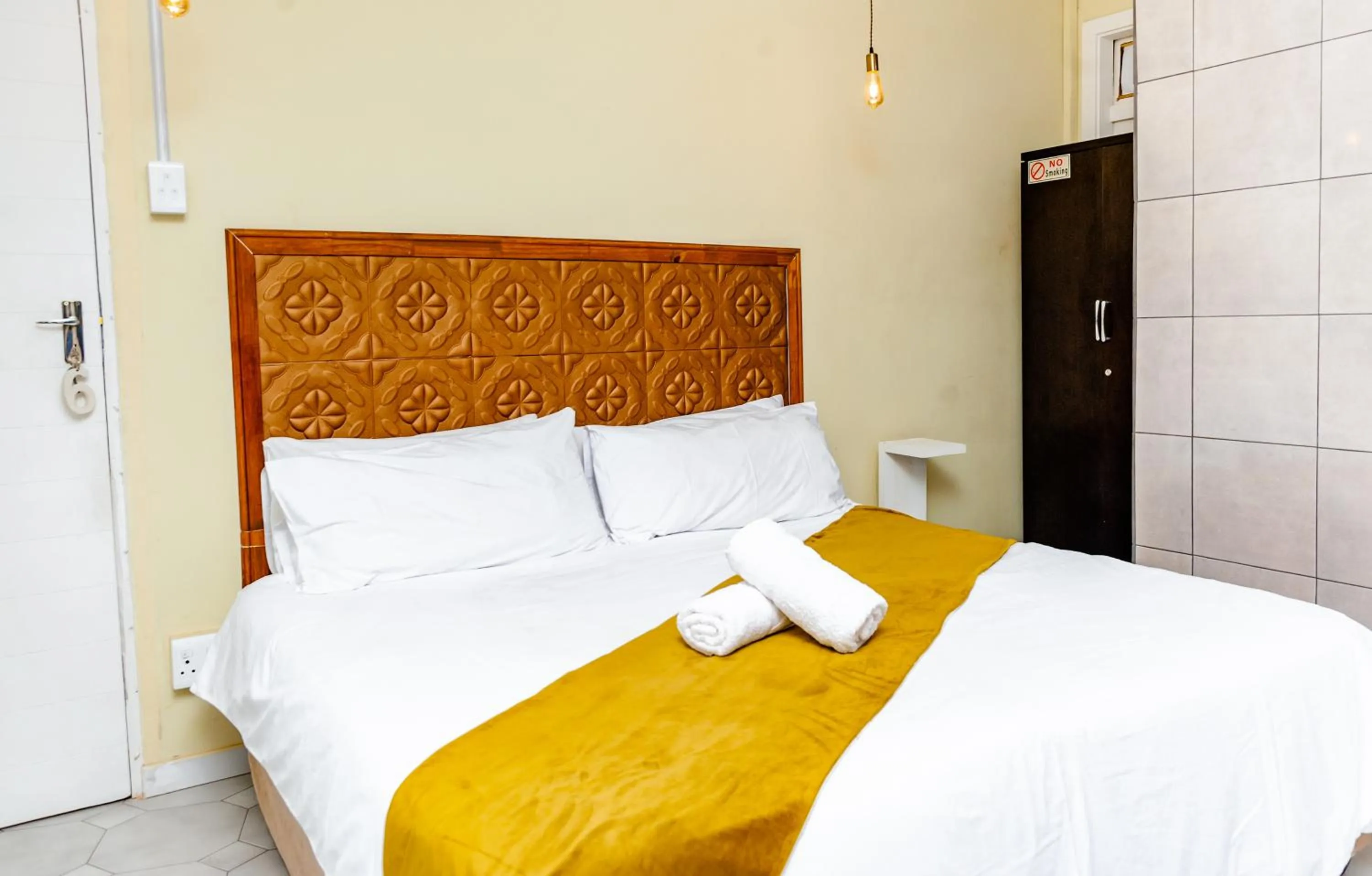 towels, Bed in Nkosazana Guest House