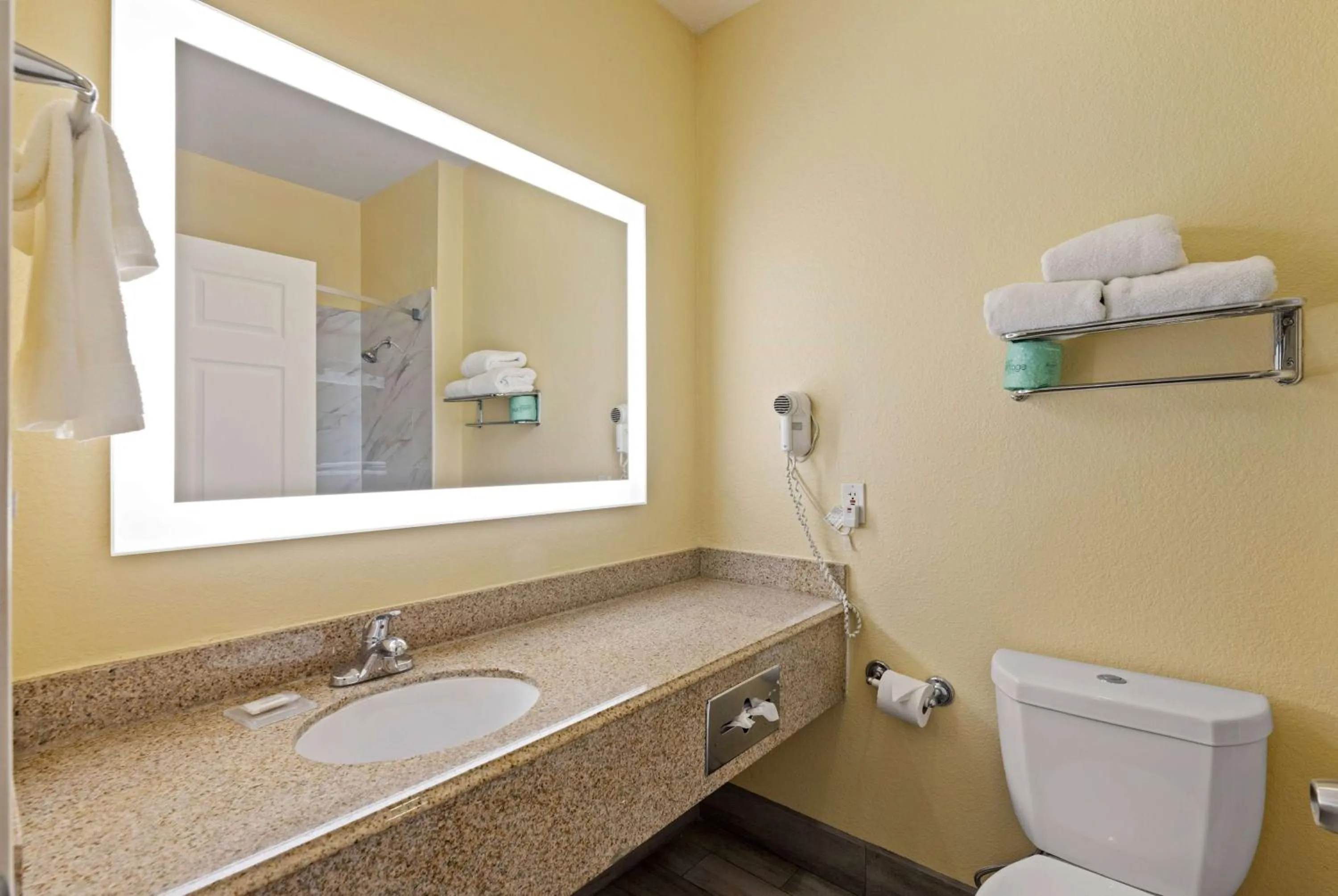 Bathroom in Days Inn & Suites by Wyndham DFW Airport South-Euless