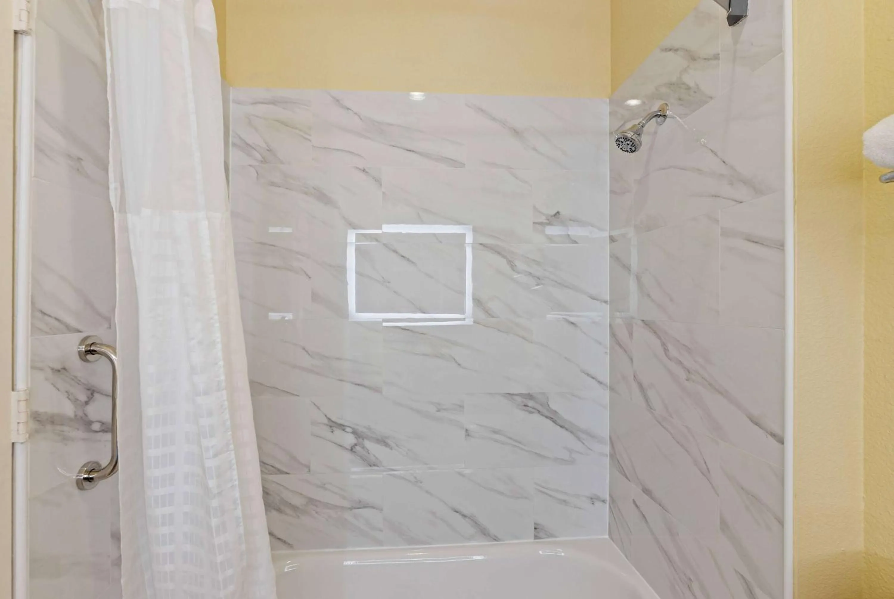 Bathroom in Days Inn & Suites by Wyndham DFW Airport South-Euless