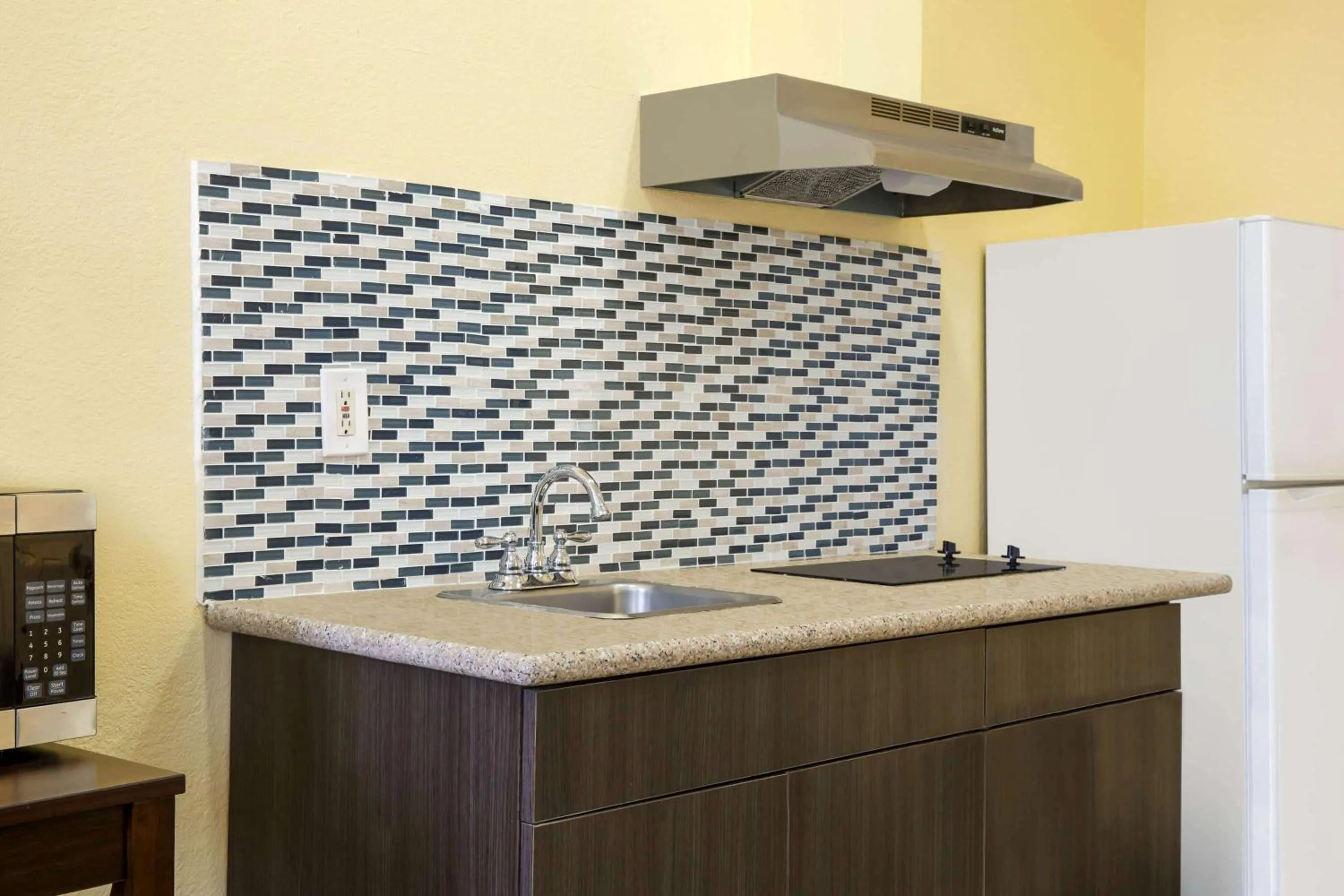 Photo of the whole room in Days Inn & Suites by Wyndham DFW Airport South-Euless