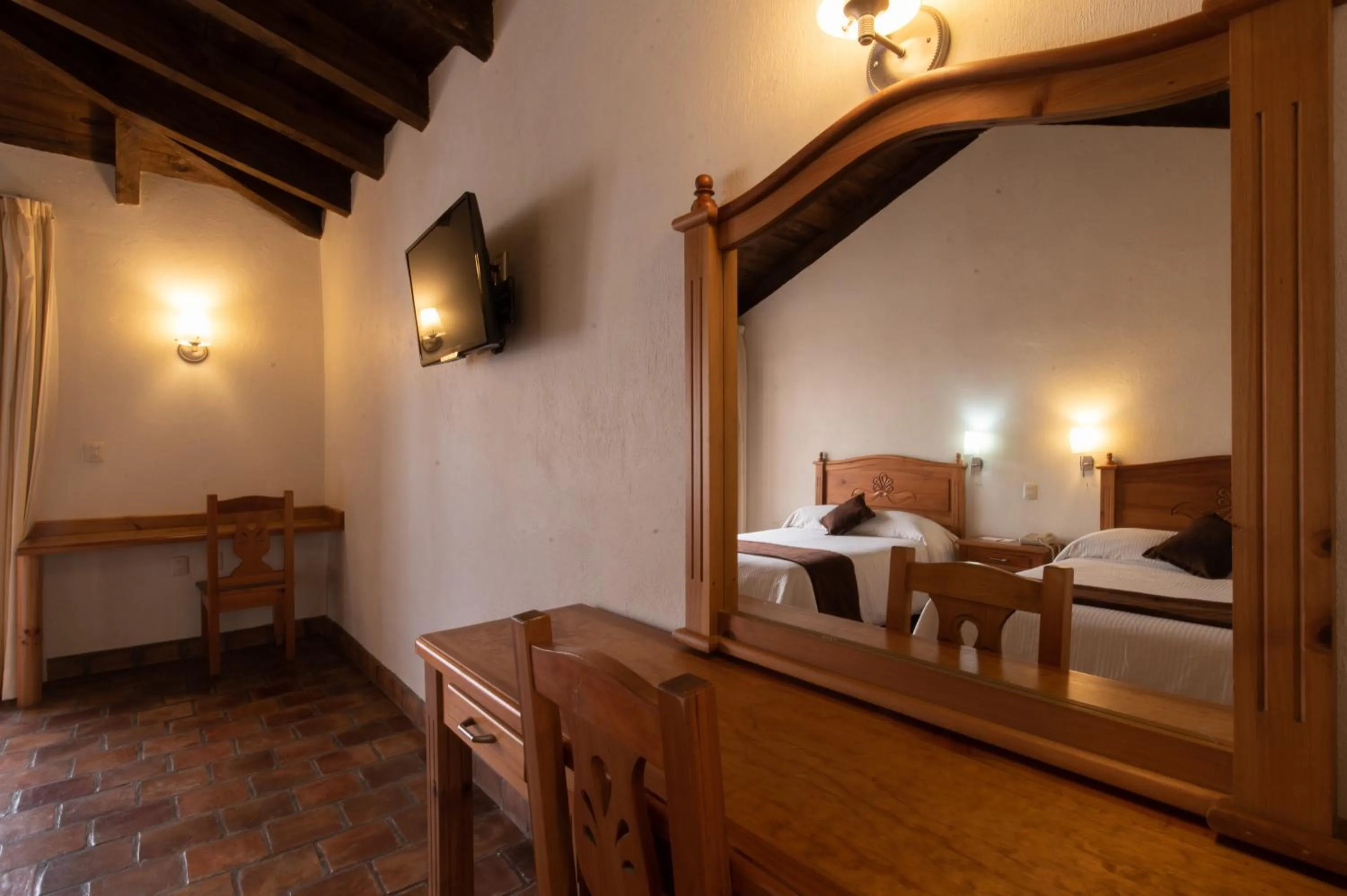 Bed in Plaza Magnolias Suites