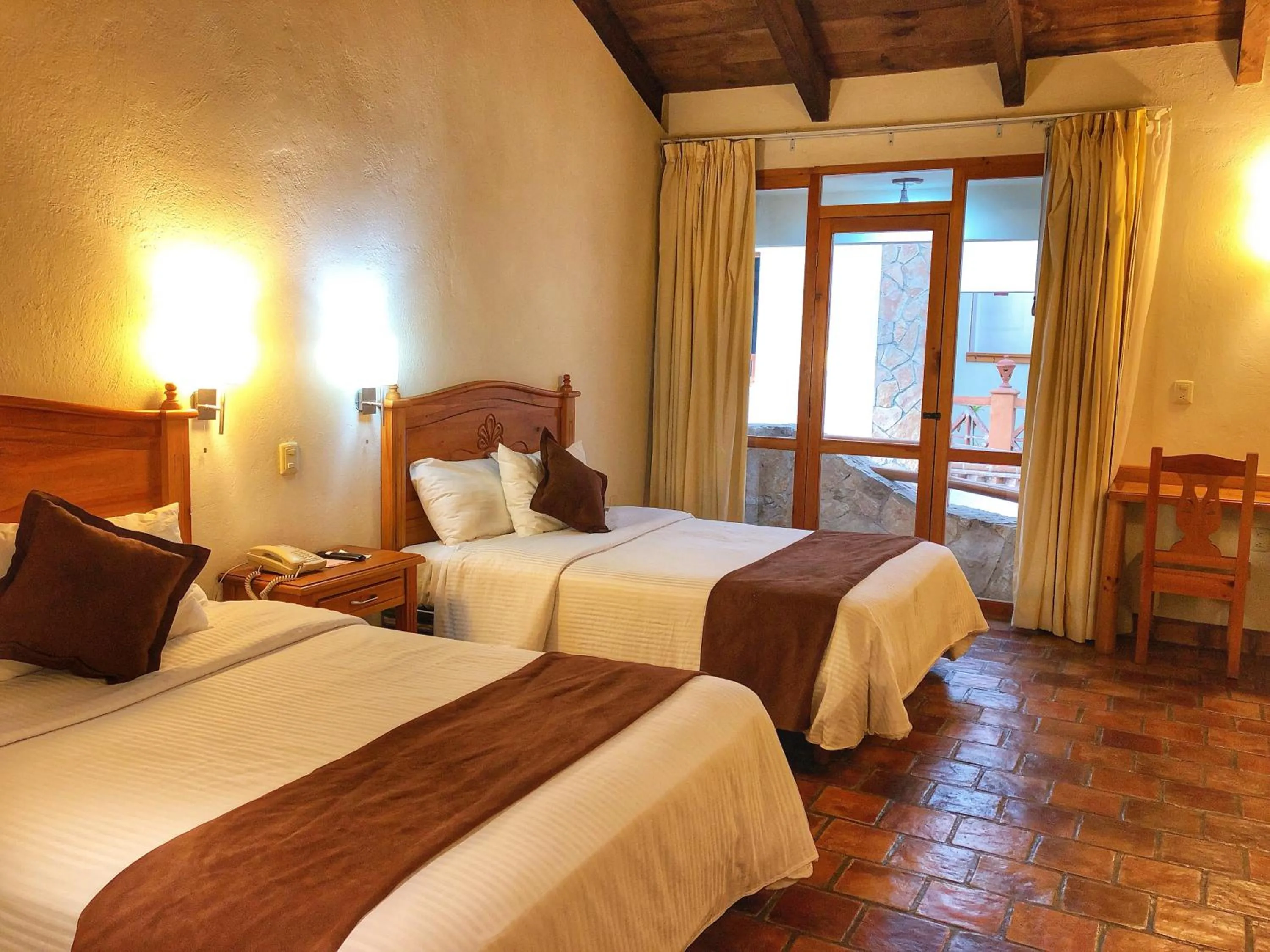 Bed in Plaza Magnolias Suites