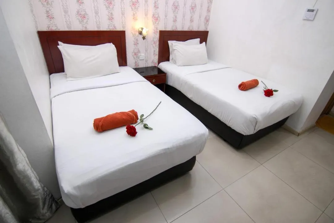 Bed in Rose Cottage Hotel Taman Perling