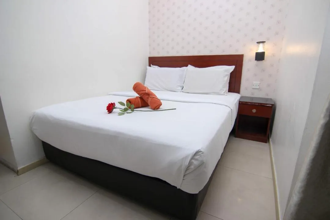 Bed in Rose Cottage Hotel Taman Perling