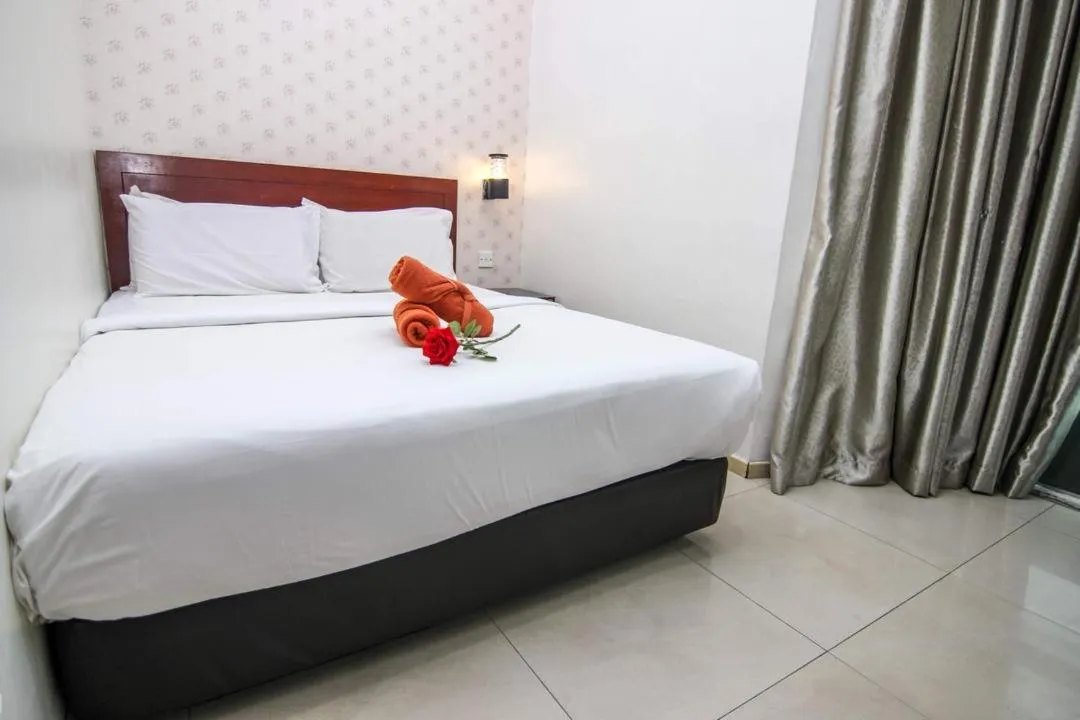 Bed in Rose Cottage Hotel Taman Perling