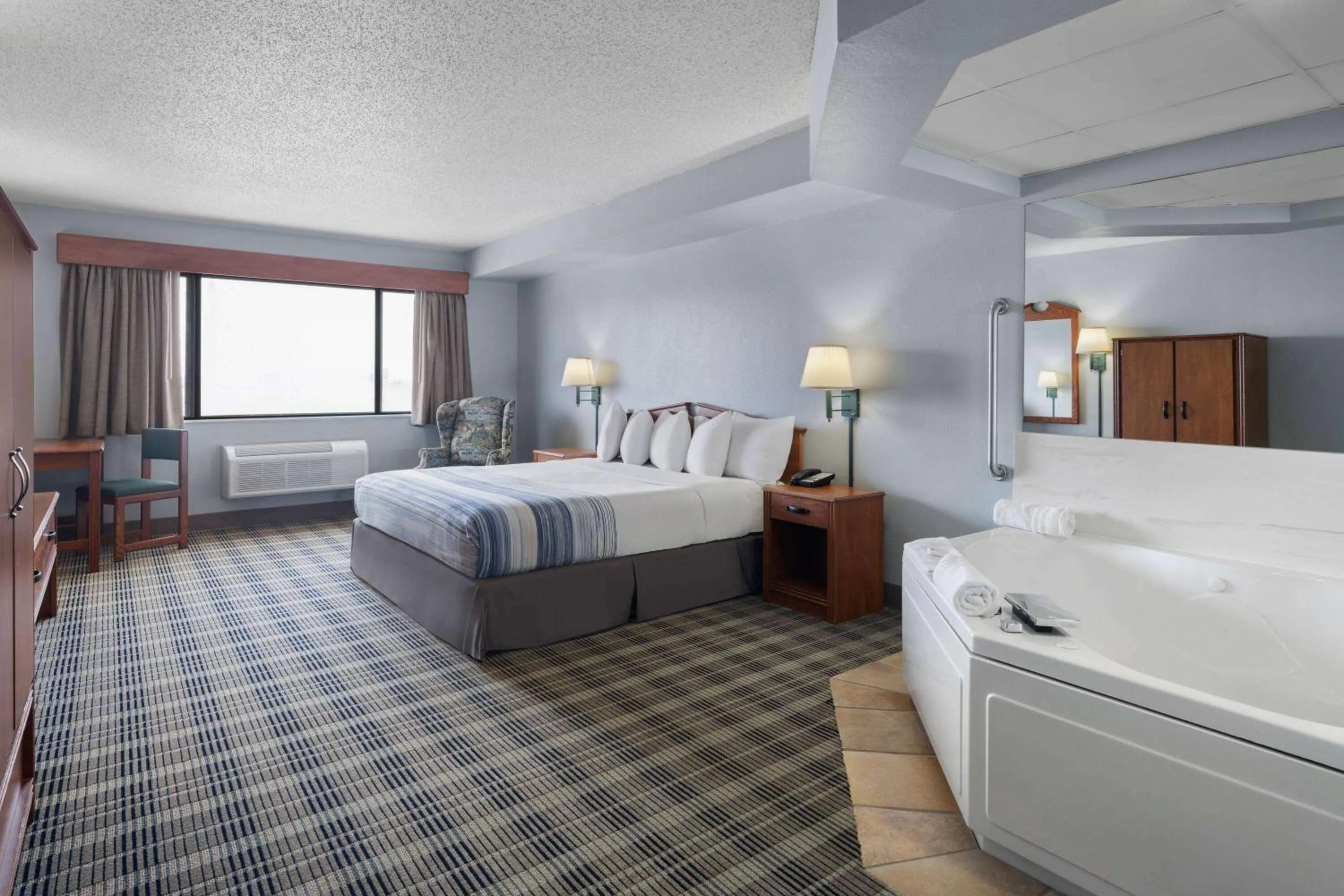 Photo of the whole room, Bed in AmericInn by Wyndham Stuart